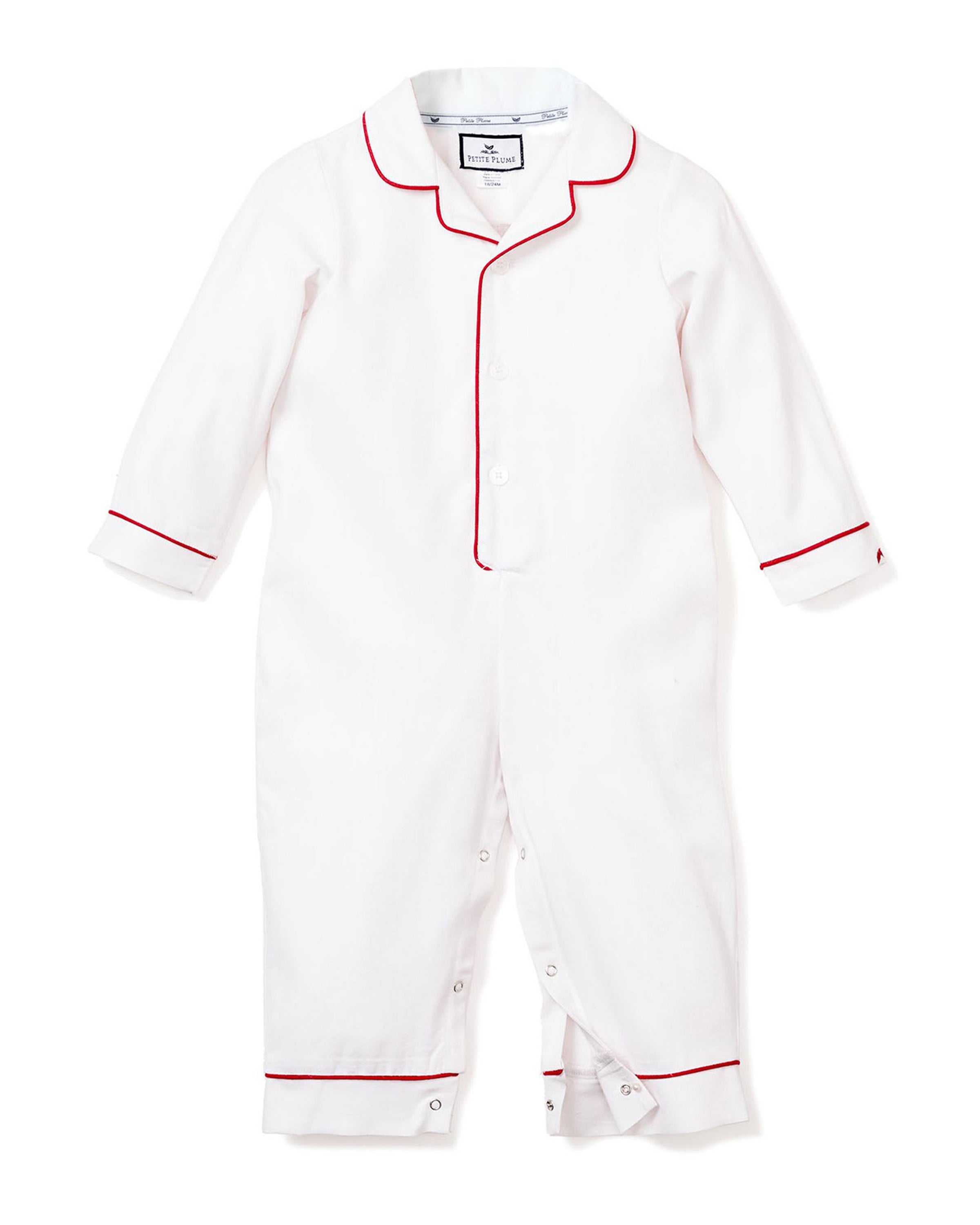 The Babys Twill Romper by Petite Plume is a cozy white onesie with long sleeves and red piping along the collar, cuffs, and front. It features buttons from neck to feet, folded cuffs, and ankle hems for added comfort.