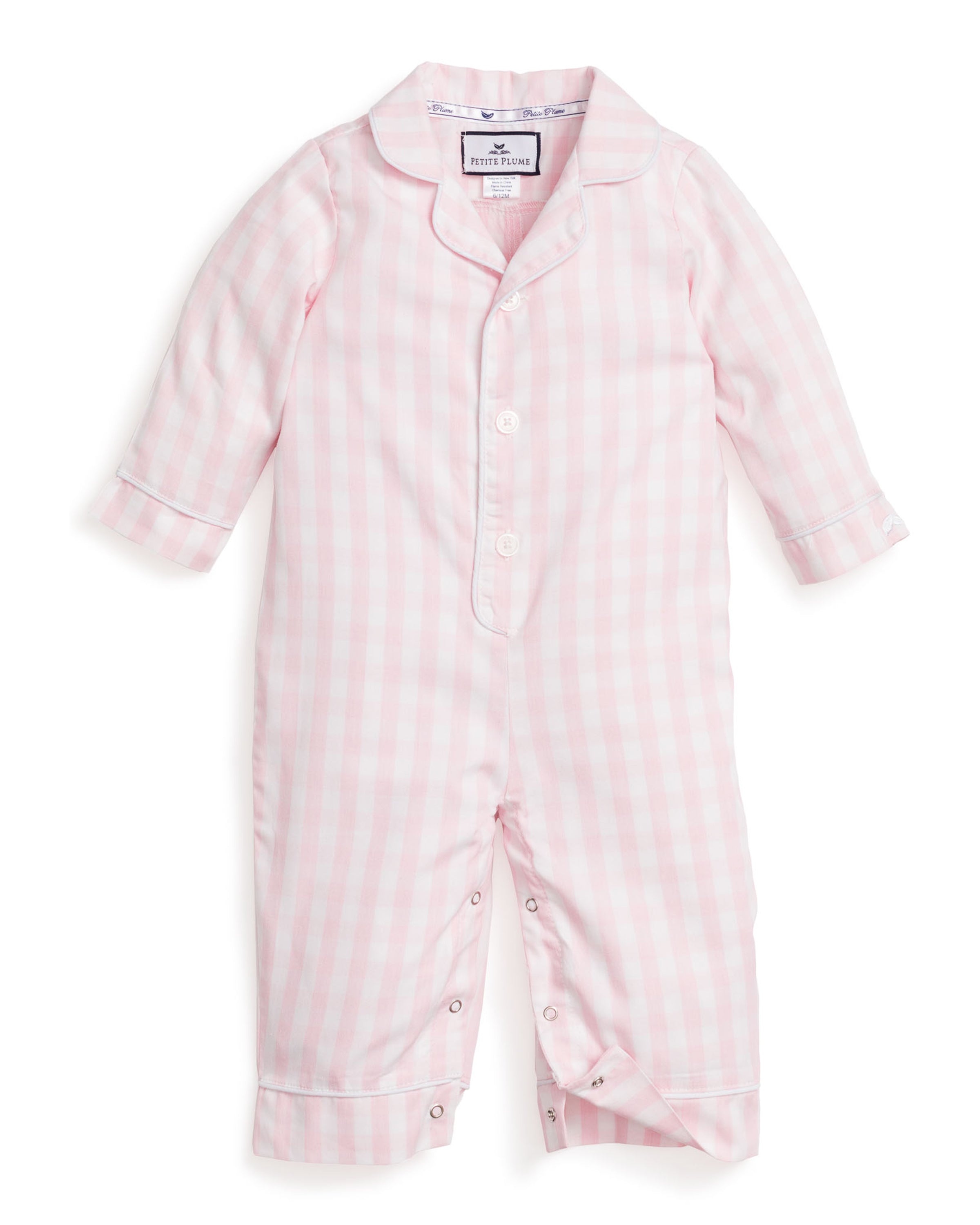 The Petite Plume Babys Twill Romper in Pink Gingham is a light pink and white checkered romper made from yarn-dyed cotton, with long sleeves, collar, wrist and ankle cuffs. It has front buttons and leg snaps for easy changing.