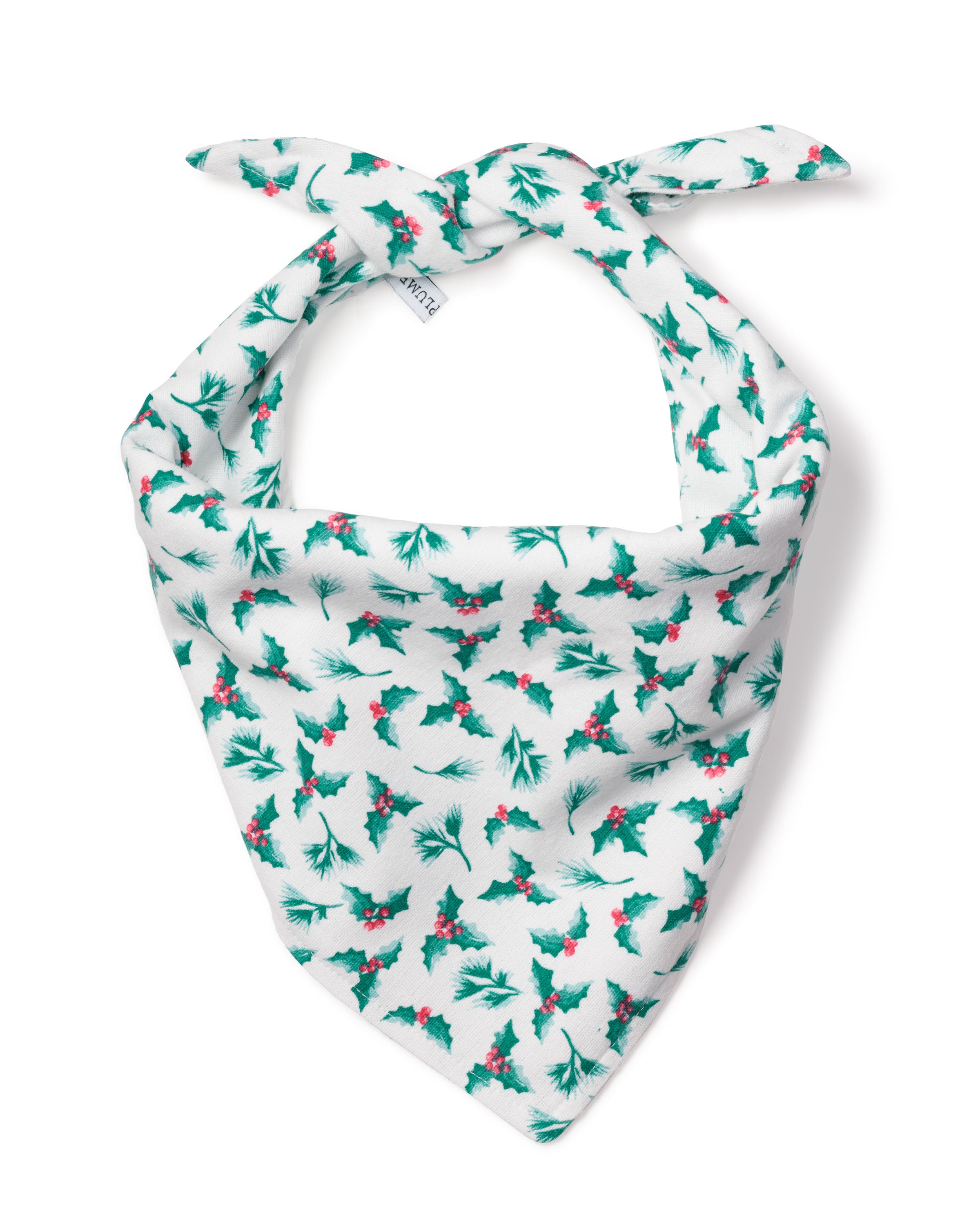 The Petite Plume Dog Bandana in Sprigs of the Season is a festive white dog accessory with holly, featuring green leaves and red berries, tied at the top—perfect for holiday fashion.