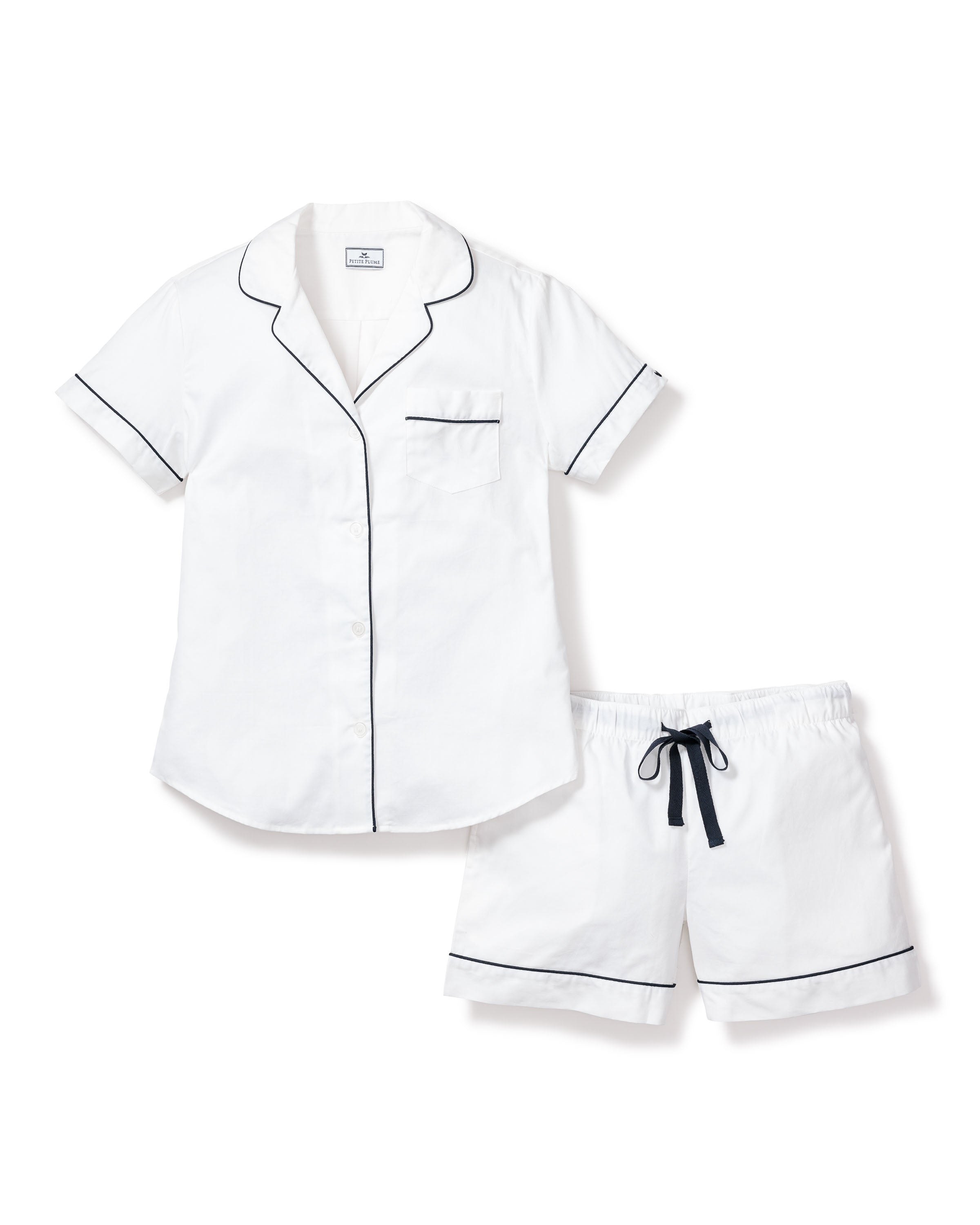 Enjoy the luxury of Petite Plumes Womens Twill Pajama Short Set in white with navy piping. This stylish set features a short-sleeved button-up top with a chest pocket and matching shorts, crafted from high-quality cotton for the perfect night in.