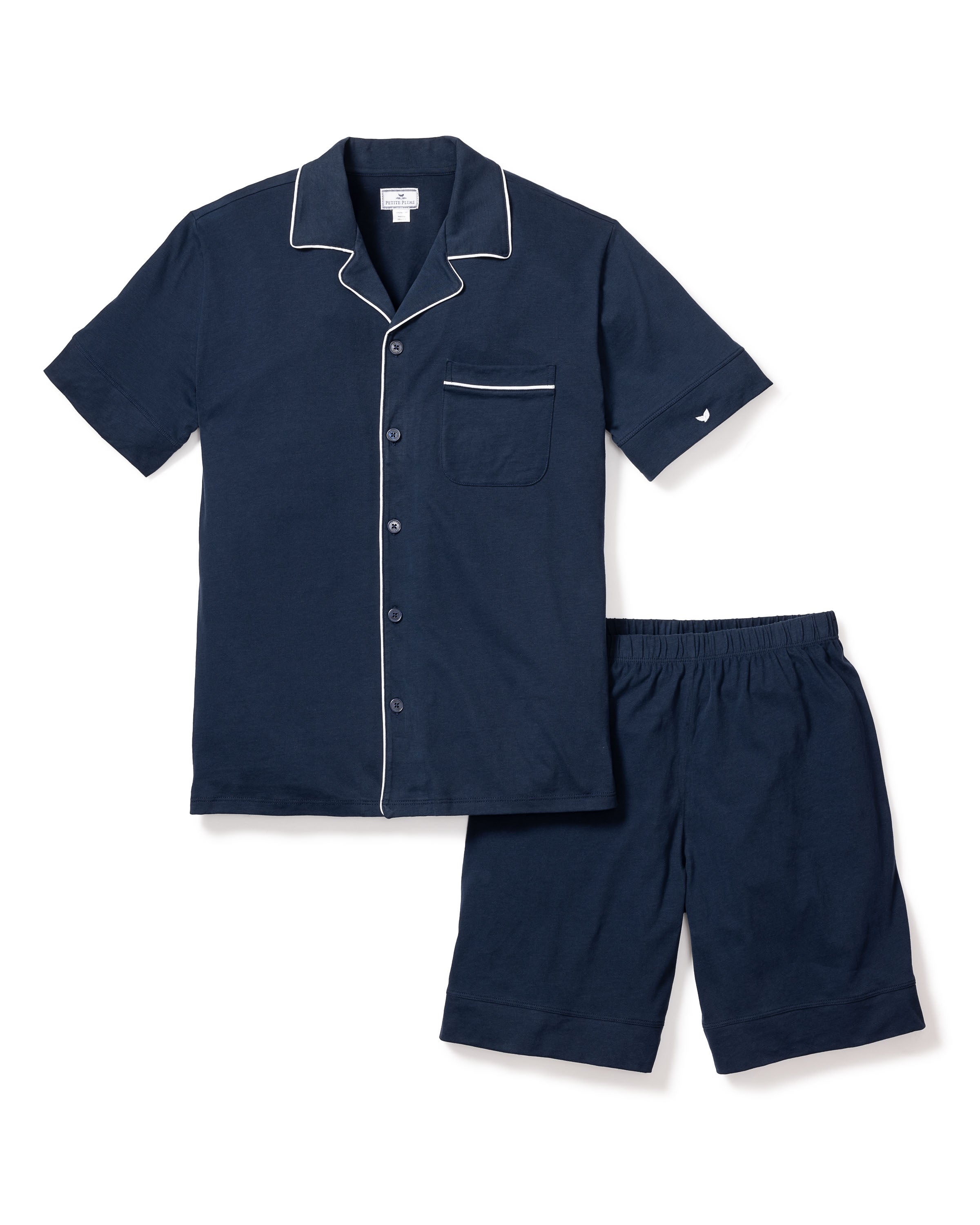 Enjoy exceptional comfort with the Mens Pima Pajama Short Set in Navy by Petite Plume. Crafted from luxurious Pima cotton, it features a notched collar, white piping, button-down front, chest pocket on the top, and matching shorts with an elastic waistband—perfect for your bedtime routine.