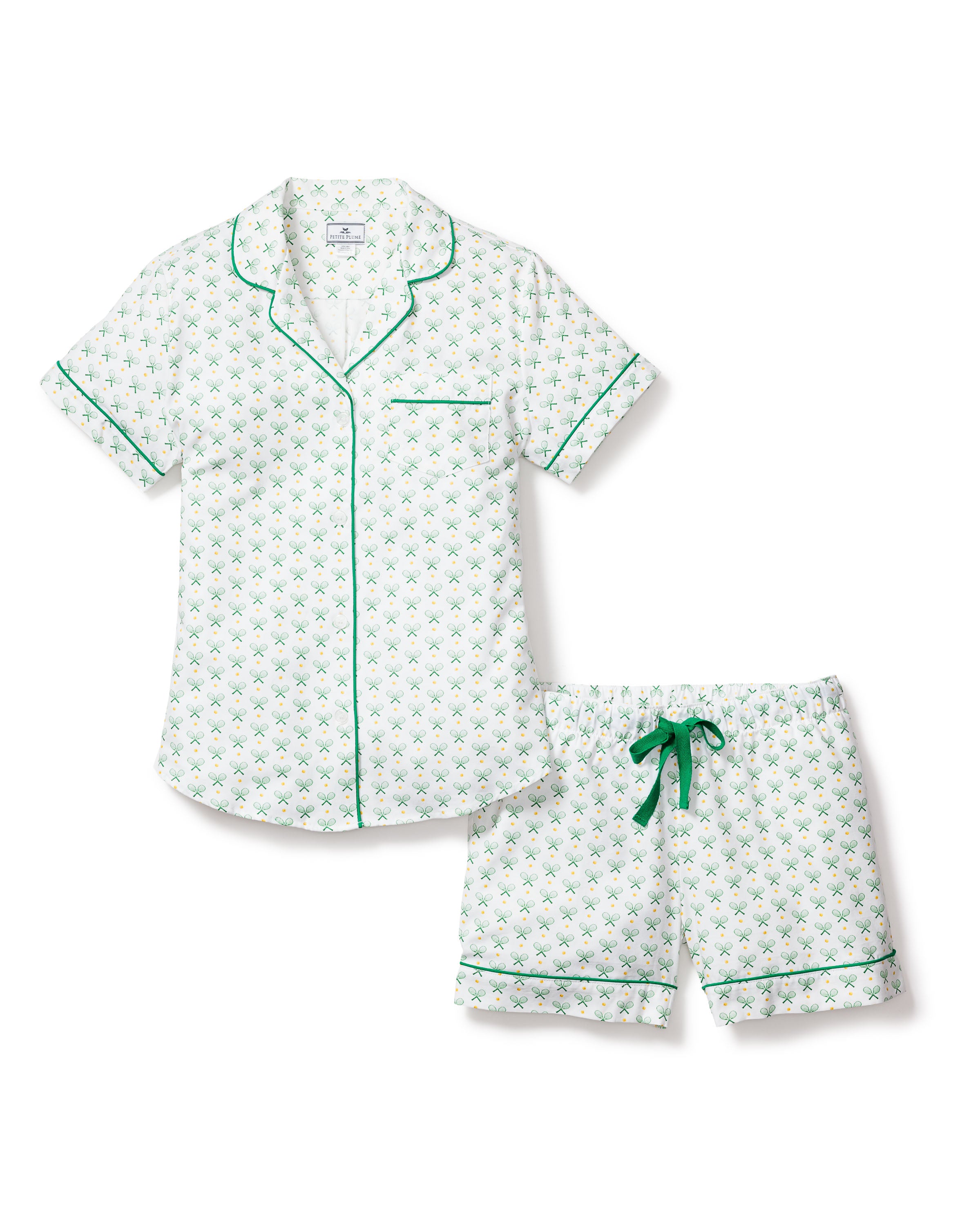 Elevate your nights with Petite Plumes Womens Twill Pajama Set in Match Point. This luxurious white cotton sleepwear features a green floral pattern, a short-sleeve button-up shirt with green piping and chest pocket, and matching shorts with a drawstring and piped hem.