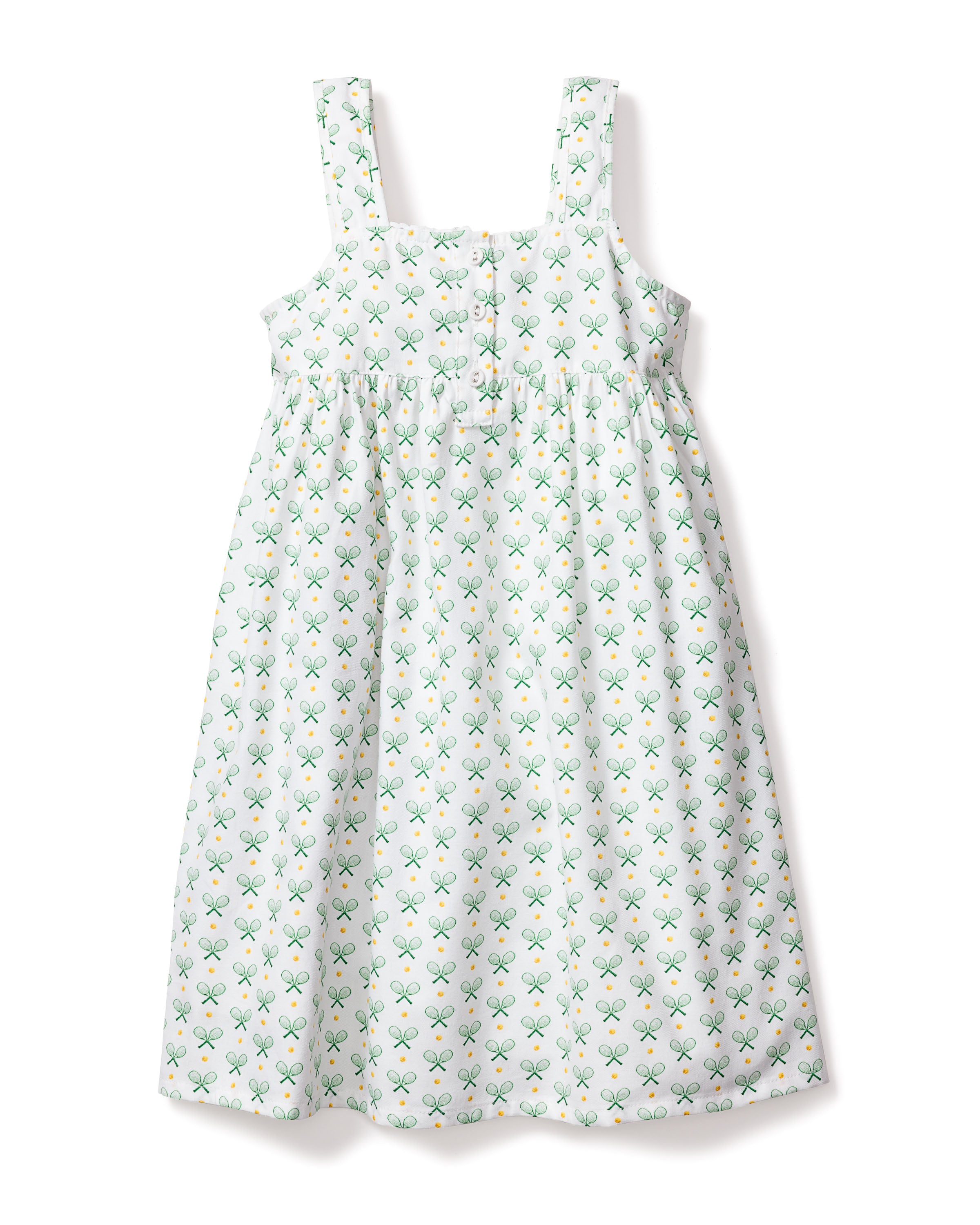 The Girls Twill Charlotte Nightgown in Match Point by Petite Plume is a sleeveless, knee-length white dress with green tennis racket and ball motifs. It features a gathered waist and wide shoulder straps, offering comfort and a chic tennis-inspired style.