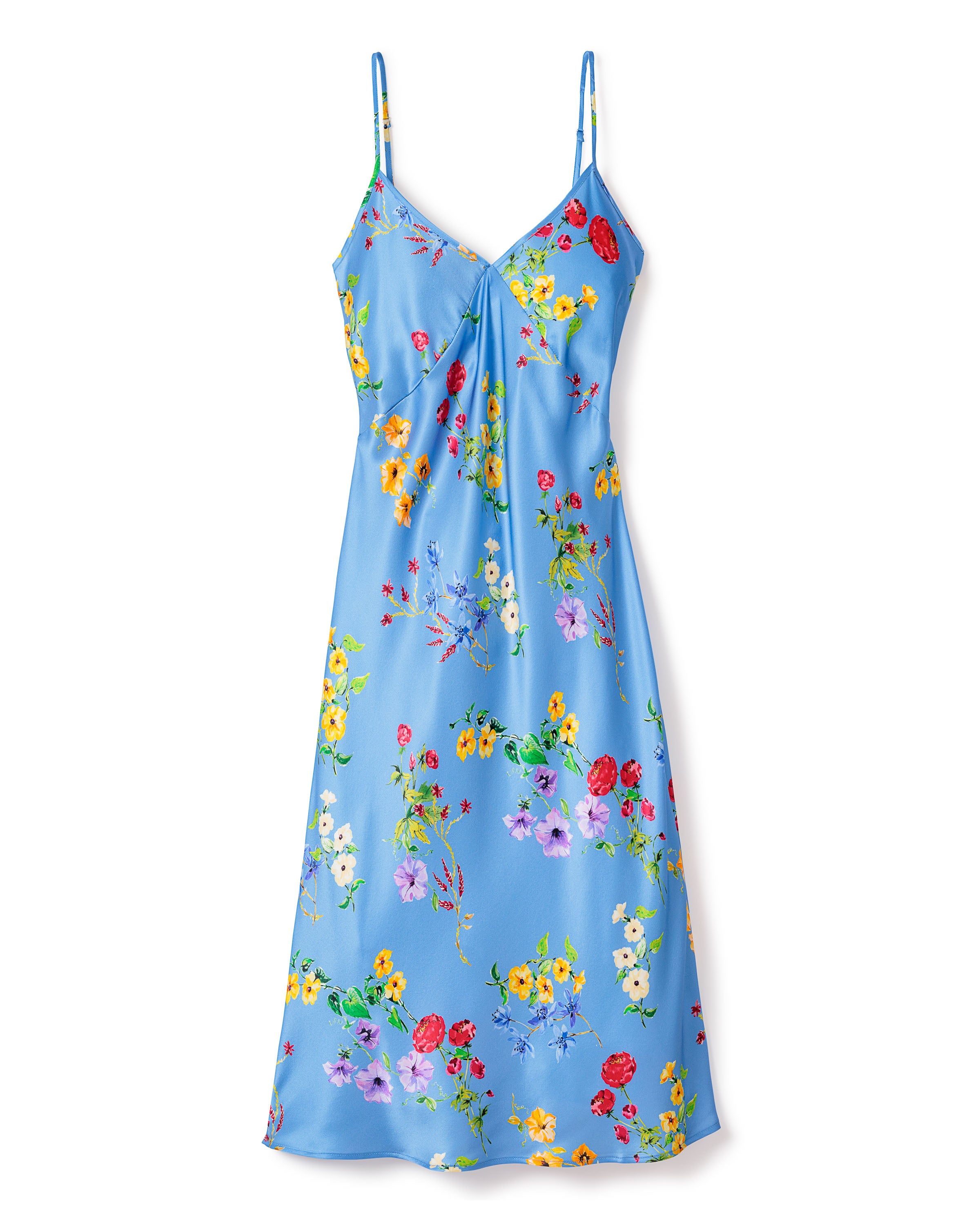 The Womens Silk Cosette Nightgown in Azure Brilliant Botanical by Petite Plume is a sleeveless, knee-length blue dress with vibrant botanical prints, featuring thin straps and a slightly gathered neckline, offering the flowy elegance of luxury sleepwear suitable for day wear.