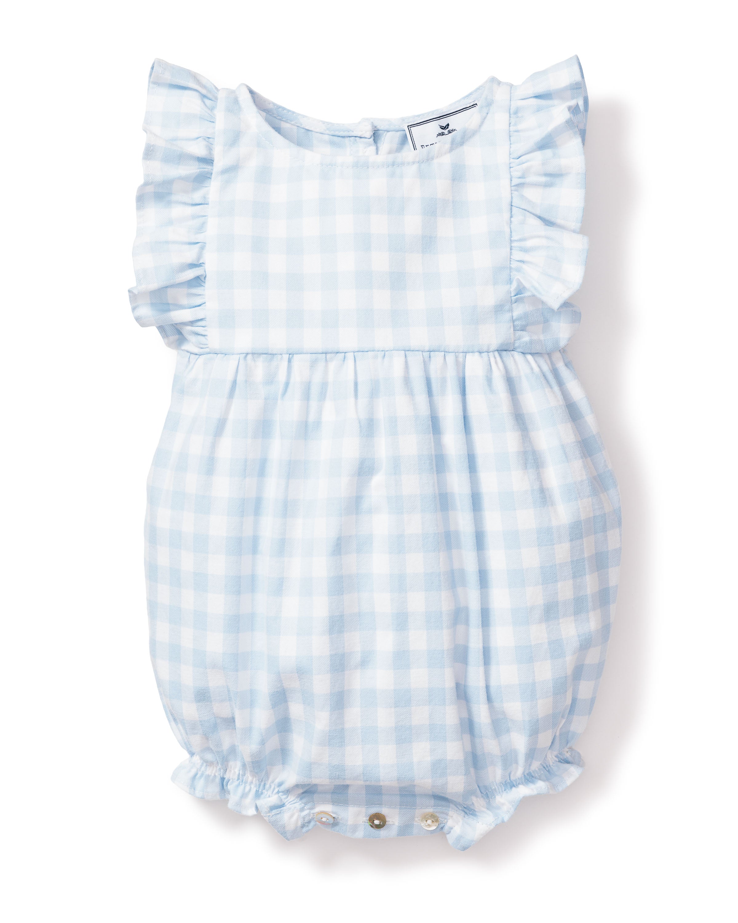 The Babys Twill Ruffled Romper by Petite Plume features a light blue gingham pattern, ruffled sleeves, and leg openings. Made from flame-retardant cotton, its designed as cozy sleepwear with convenient bottom buttons for easy closure.