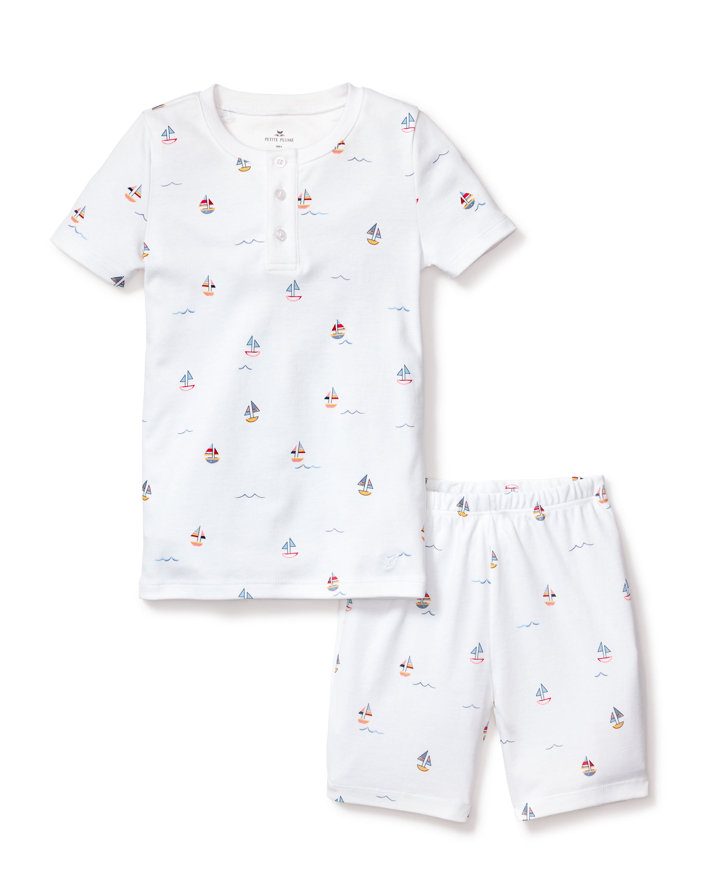 The Petite Plume Kids Pima Snug Fit Pajama Short Set in Bateau features a soft Pima Cotton white short-sleeve top with front buttons and colorful Bateau print shorts.