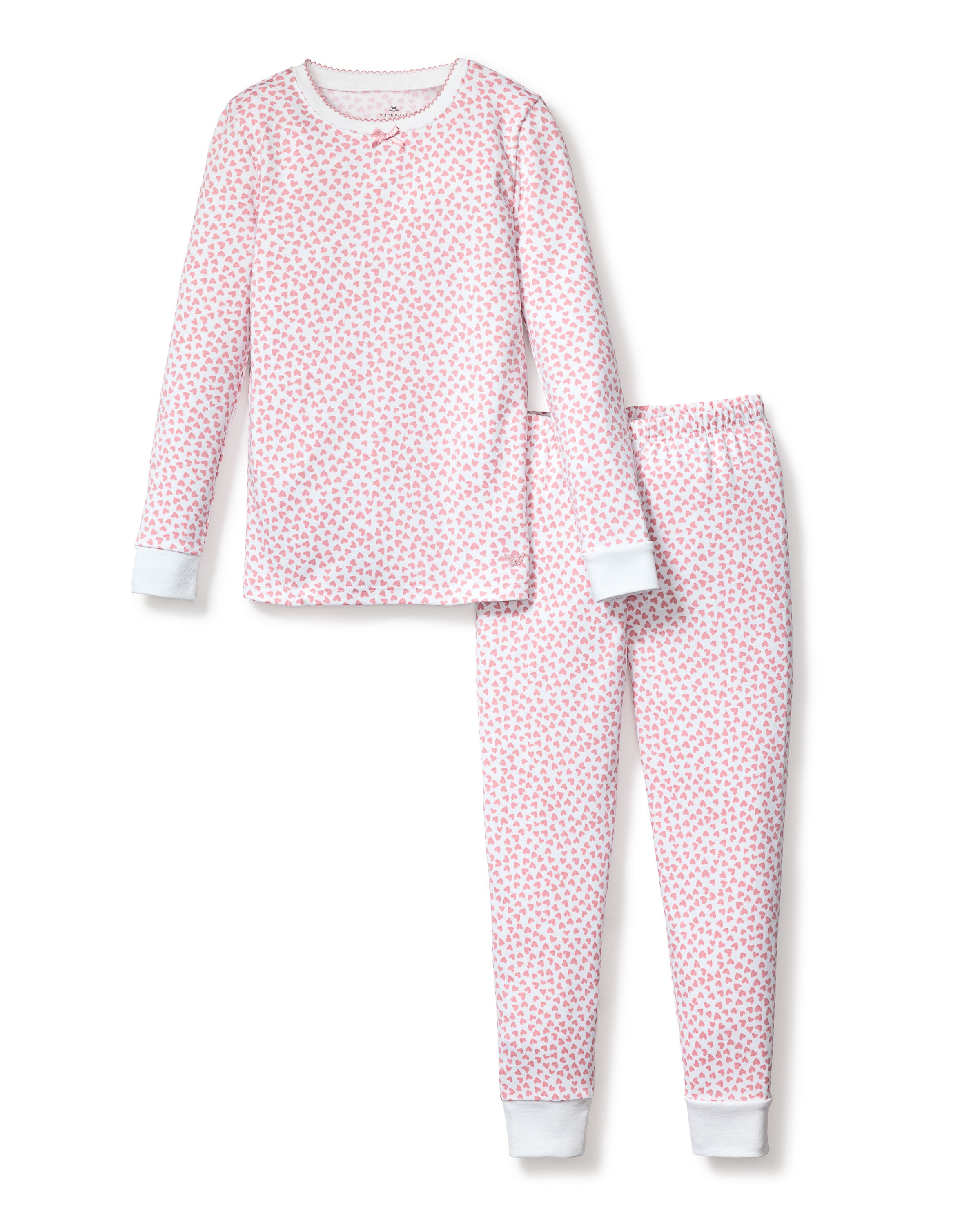 The Kids Pima Snug Fit Pajama Set in Sweethearts by Petite Plume is crafted from soft Pima cotton, featuring a charming pink floral pattern on white. This luxurious two-piece includes a long-sleeved top and matching pants, both with elegant white cuffs for the perfect nights rest.