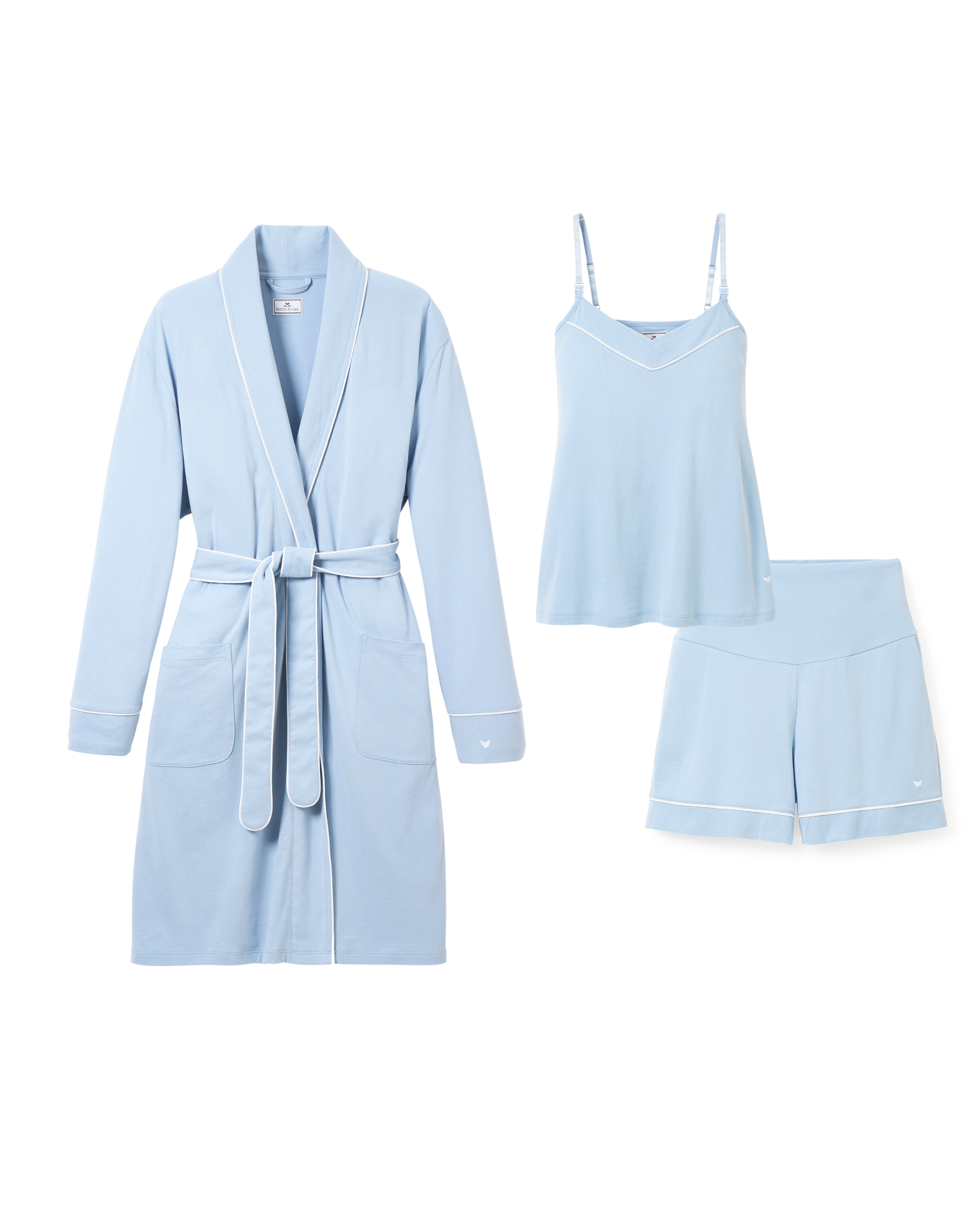Explore the ultimate summer maternity wear with Petite Plumes Must Have Maternity Set in Periwinkle. This lightweight ensemble includes a robe with a tie belt and pockets, a camisole with spaghetti straps, and shorts, all accented by delicate white trim for added charm.