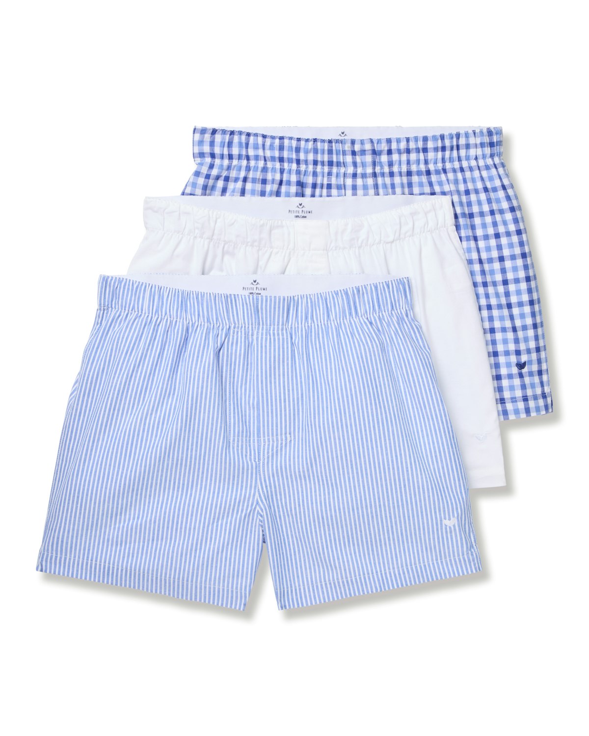 The Mens Twill 3 Pack Boxers by Petite Plume in Royal Blue Gingham feature a classic fit with one pair light blue with thin white stripes, one solid white, and the final pair showcasing a navy and white checkered pattern crafted from woven cotton twill.