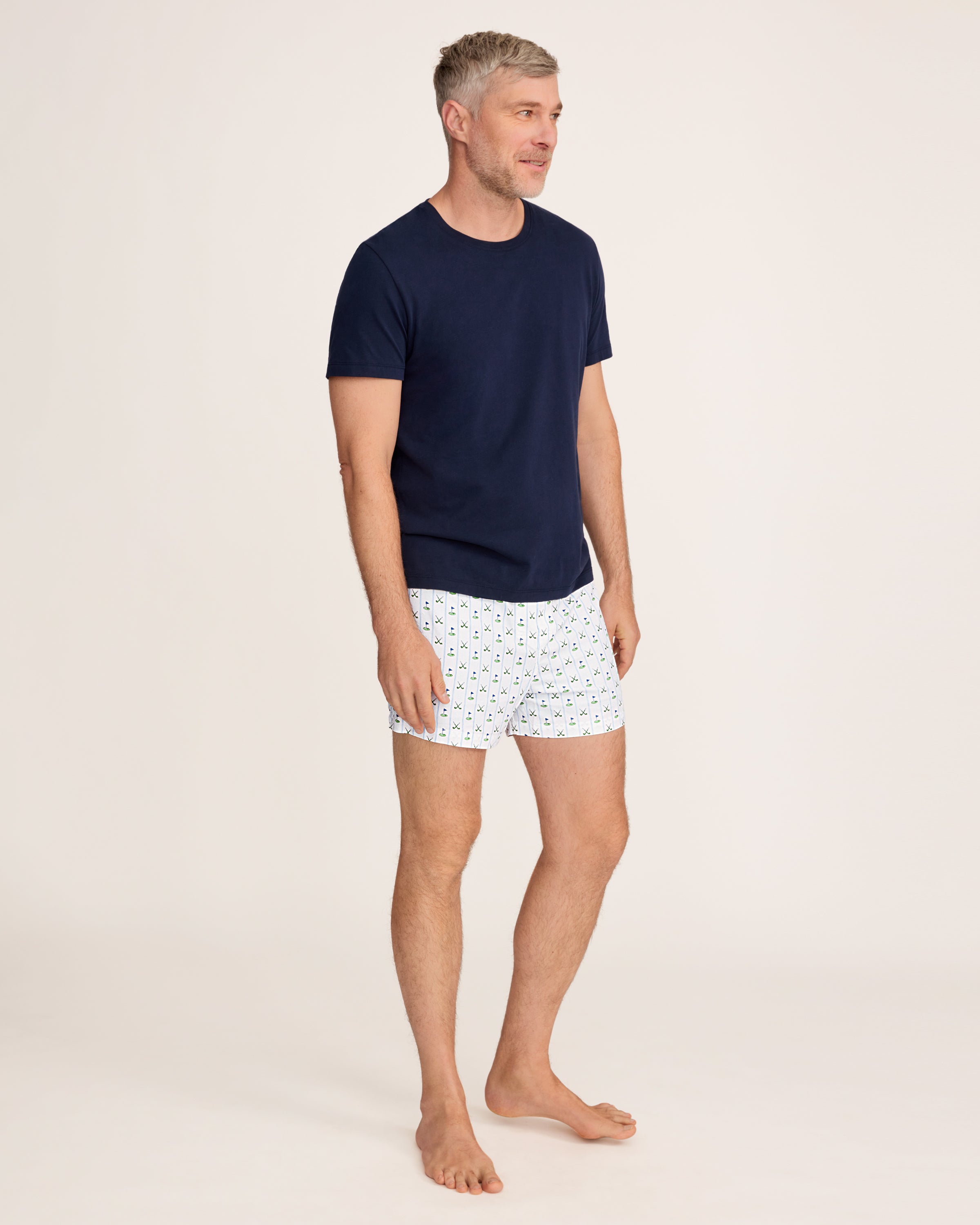 The Men's Twill 3 Pack Boxers in Fairway Stripe includes three pairs: one with blue and white vertical stripes, one solid white, and one white featuring a green and blue golf club pattern.