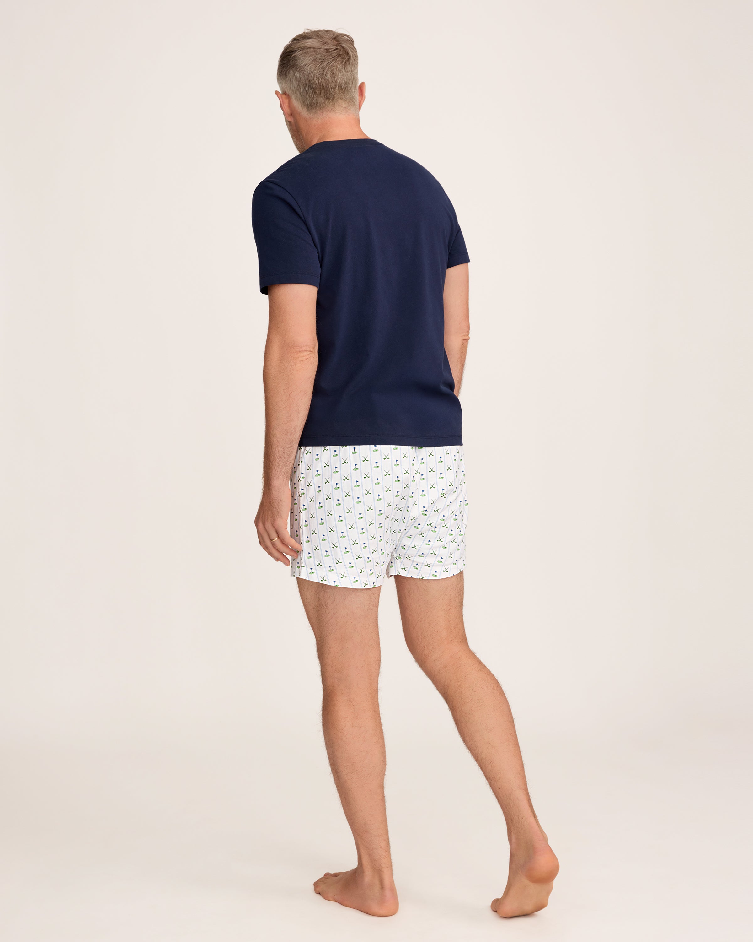 The Men's Twill 3 Pack Boxers in Fairway Stripe includes three pairs: one with blue and white vertical stripes, one solid white, and one white featuring a green and blue golf club pattern.