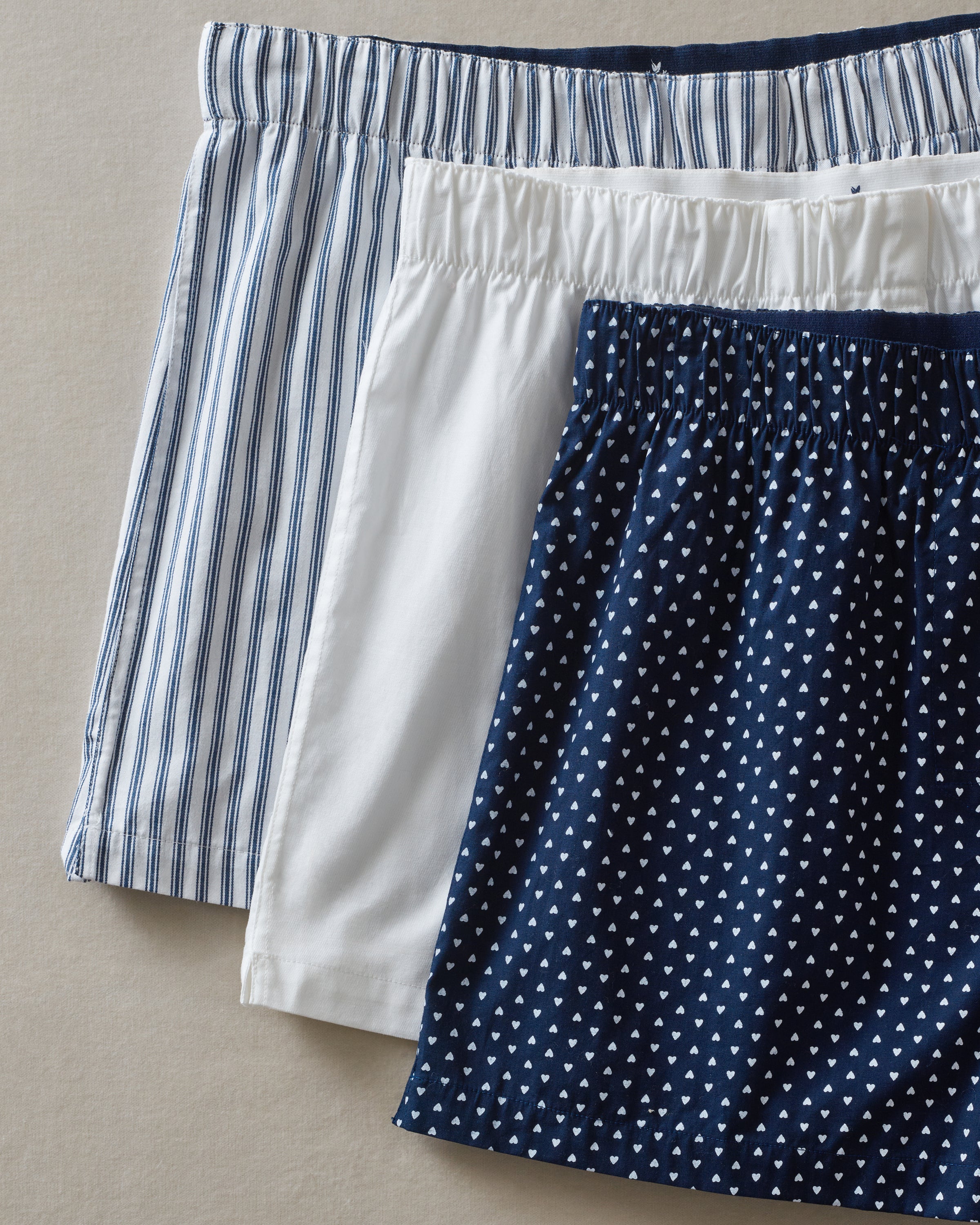 Men's Twill 3 Pack Boxers in Midnight Hearts, White, and Navy French Ticking, arranged overlapping on a white background.