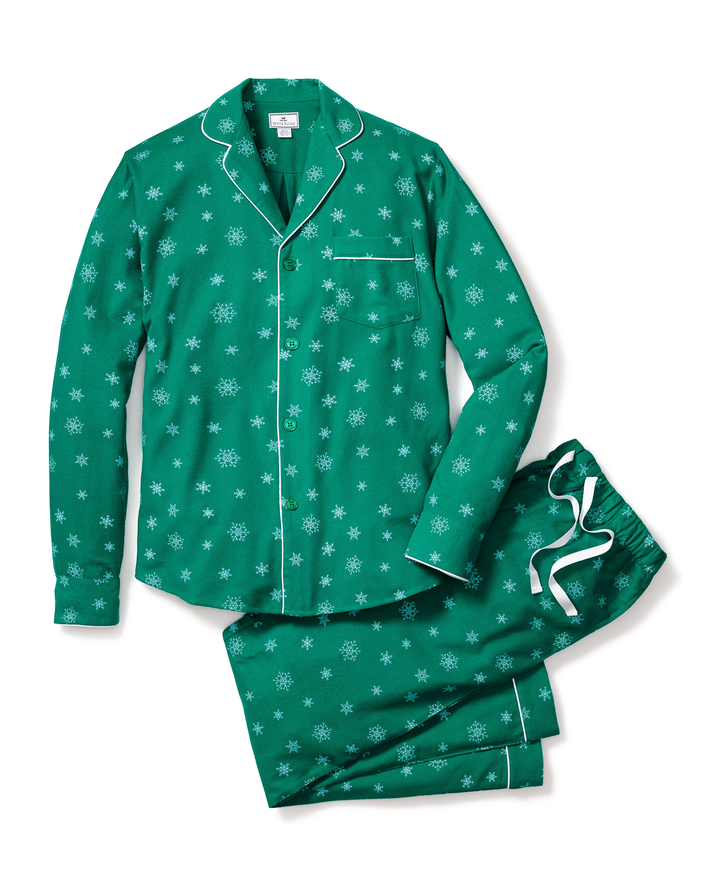 The Mens Flannel Pajama Set in Emerald Wonderland by Petite Plume features emerald green flannel pajamas with a snowflake design, including a long-sleeved button-up top and matching drawstring pants made from high-quality cotton, showcased on a white background.