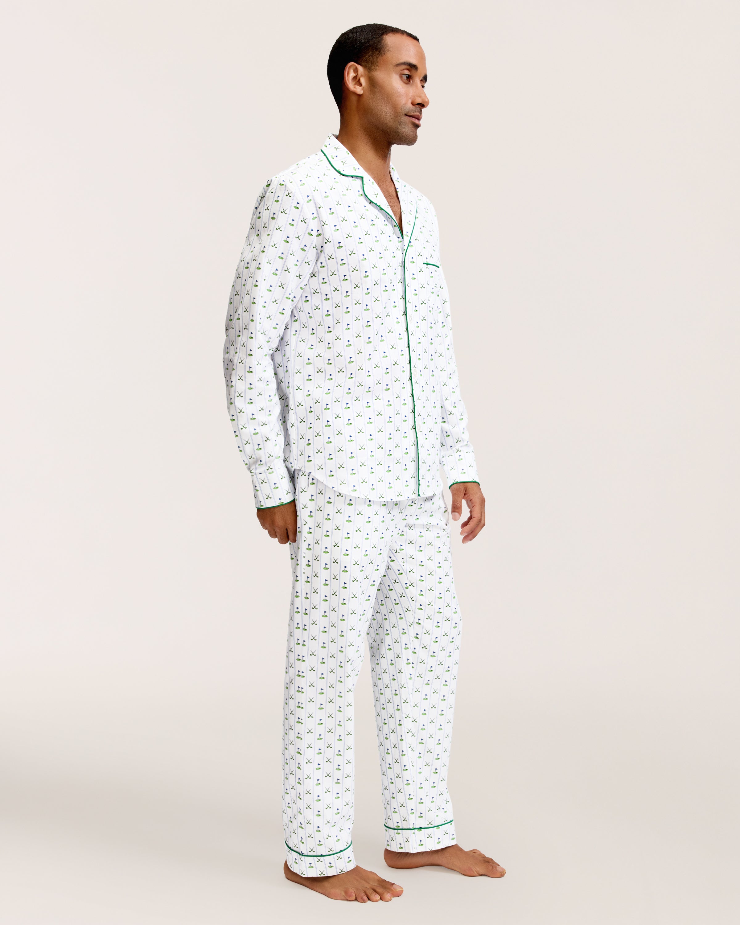 Men's Twill Pajama Set in Fairway Stripe, featuring a small green anchor pattern, green piping, chest pocket, and elastic waistband with green drawstring pants. The set is displayed neatly on a white background.