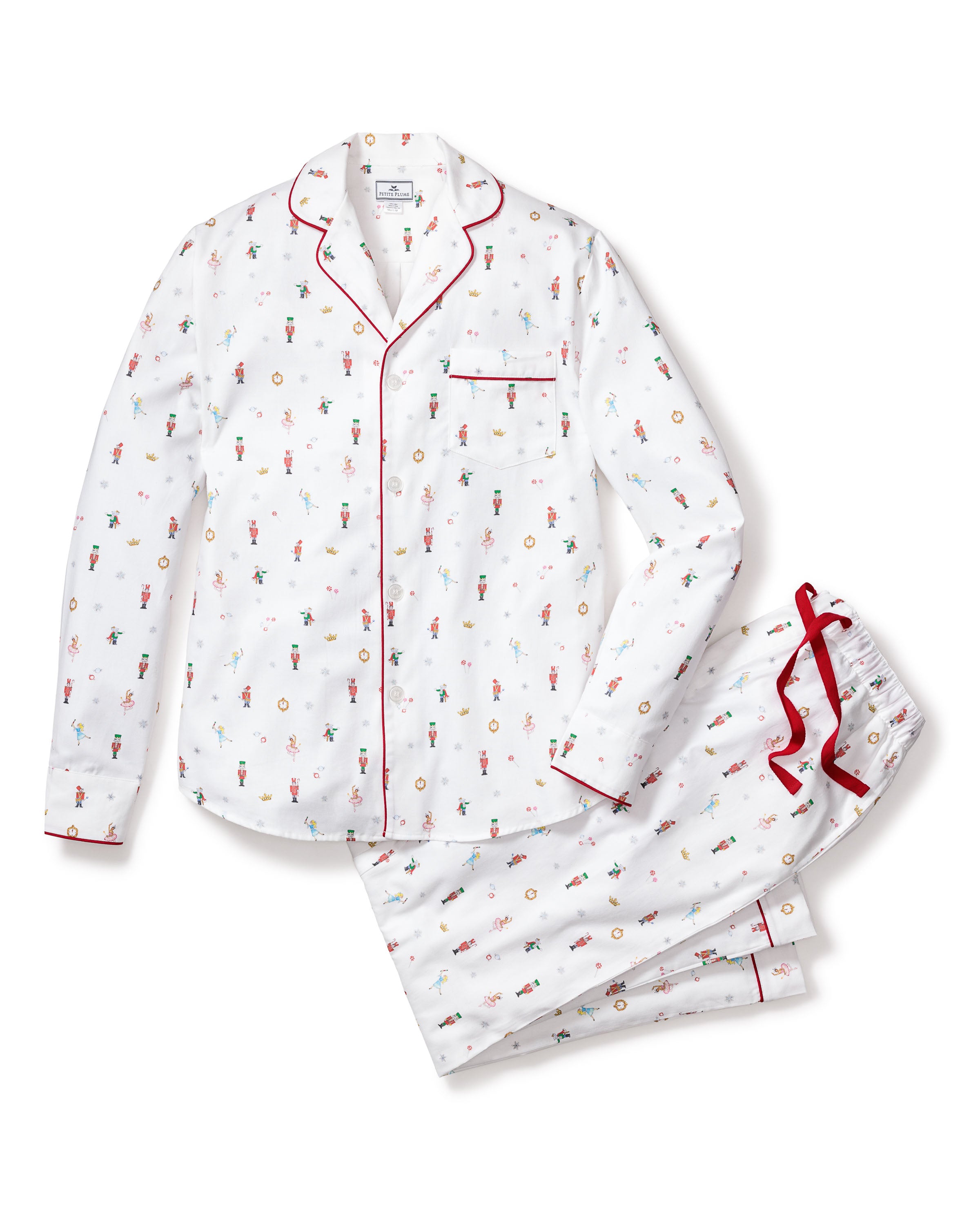 Petite Plumes Mens Twill Pajama Set in A Night at the Nutcracker combines luxurious cotton twill with a whimsical floral pattern. The long-sleeved top has red piping and a pocket, while the pants feature a red drawstring and matching piping, echoing festive Nutcracker pajamas.