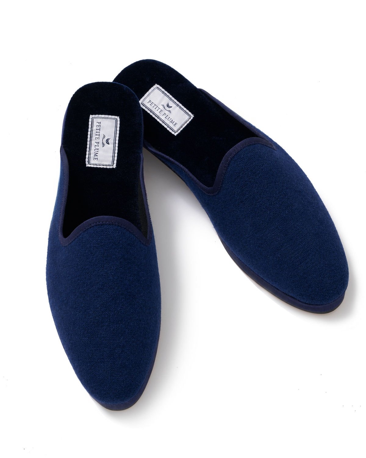 Women’s Slippers in Navy with labeled insoles are shown on a white background.