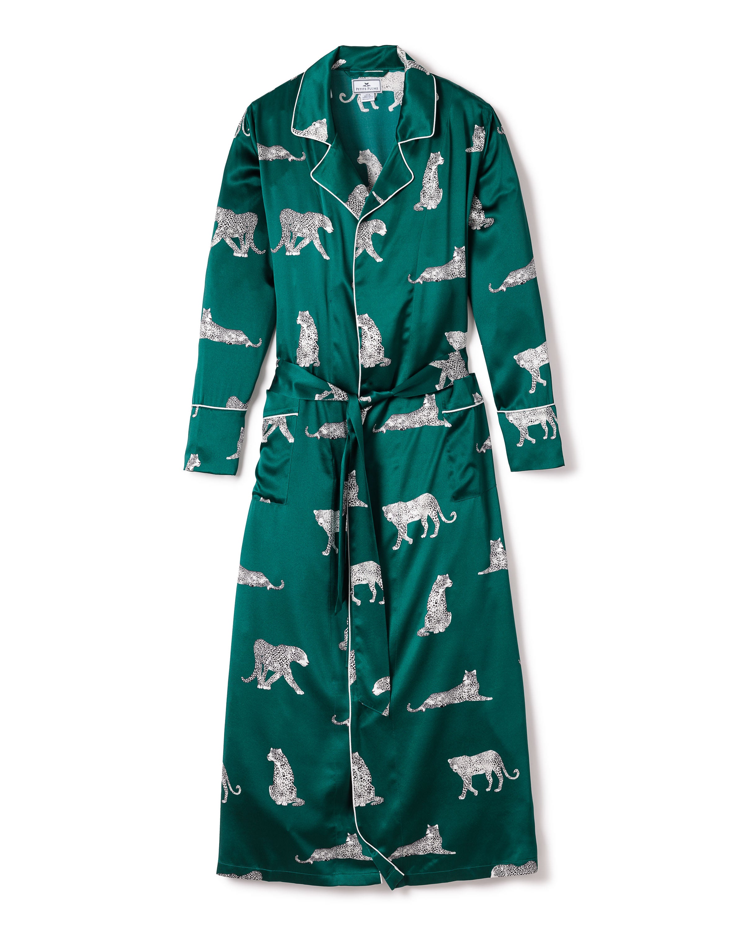 The Womens Silk Long Robe in Panthère de Luxe by Petite Plume is made from mulberry silk with a white panther print. It features a shawl collar, long sleeves, a matching belt at the waist, and elegant edges highlighted by contrasting white piping.
