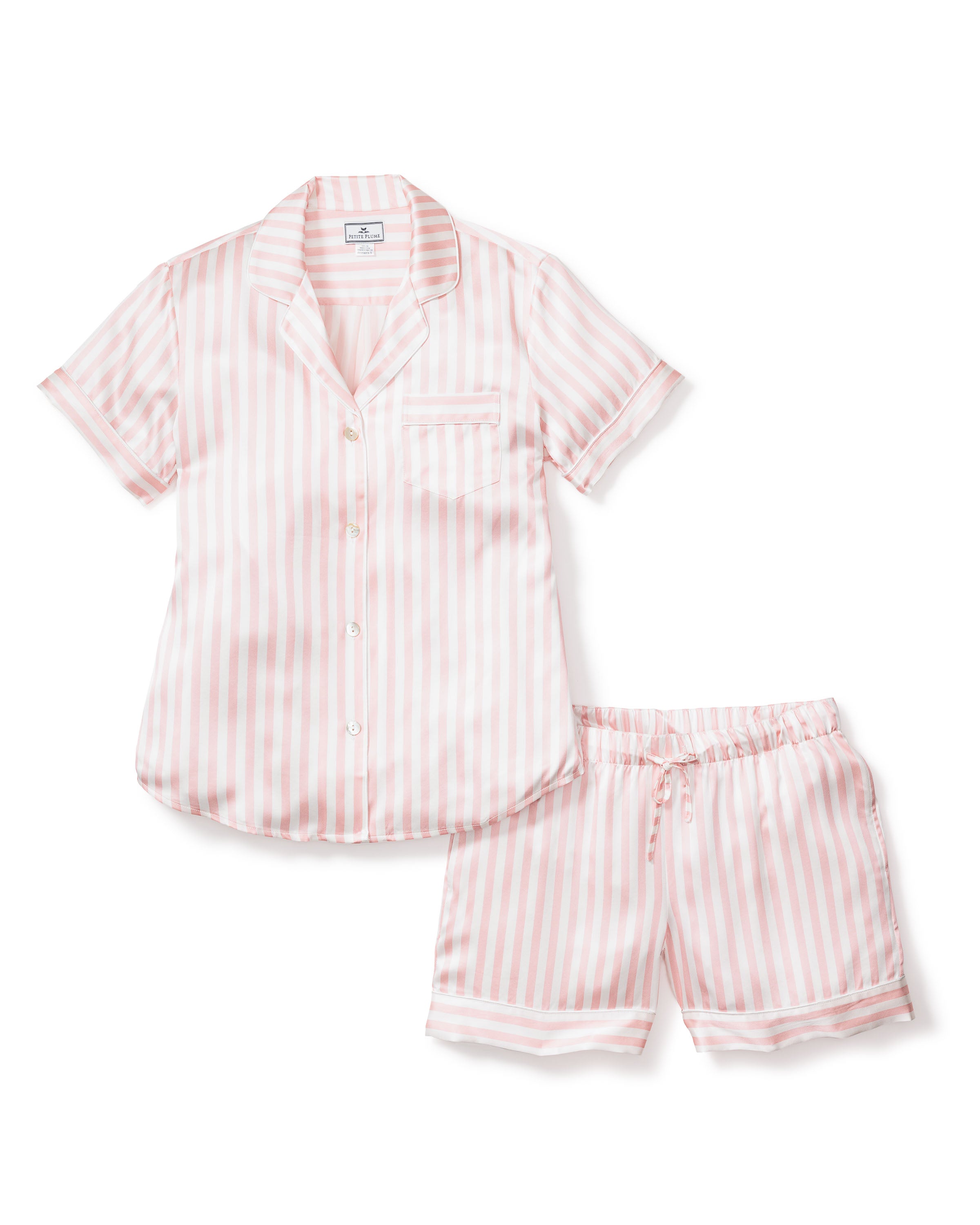 Enjoy luxurious sleep in Petite Plumes Womens Silk Pajama Short Set. This ensemble includes a short-sleeved button-up shirt with a chic left chest pocket and shorts with an elastic waistband, all crafted from Mulberry silk in elegant pink and white stripes.