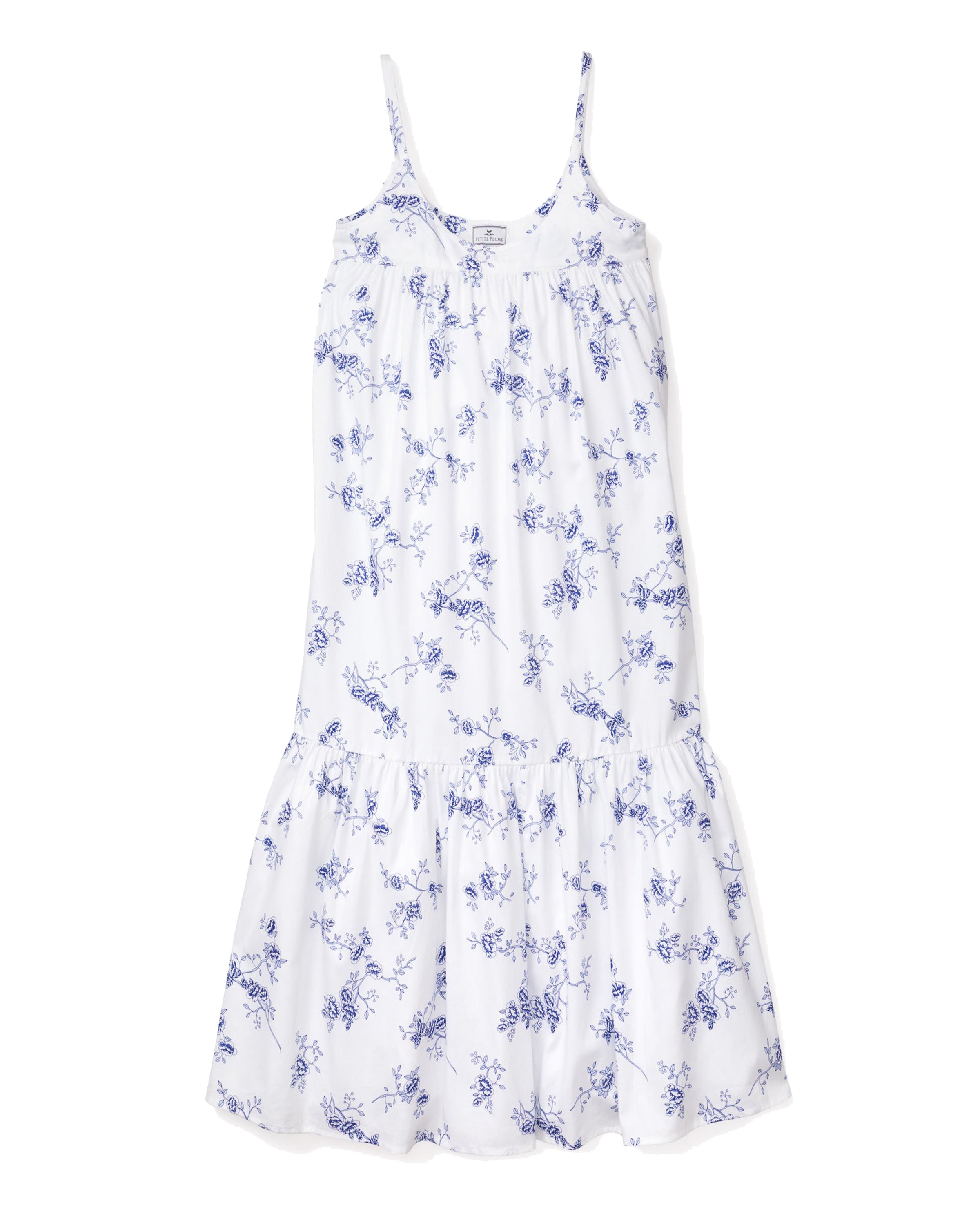 The Womens Twill Chloé Nightgown by Petite Plume, in a sleeveless white design with delicate indigo floral patterns, features thin straps and a gathered waist for a flowing silhouette reminiscent of luxury sleepwear.