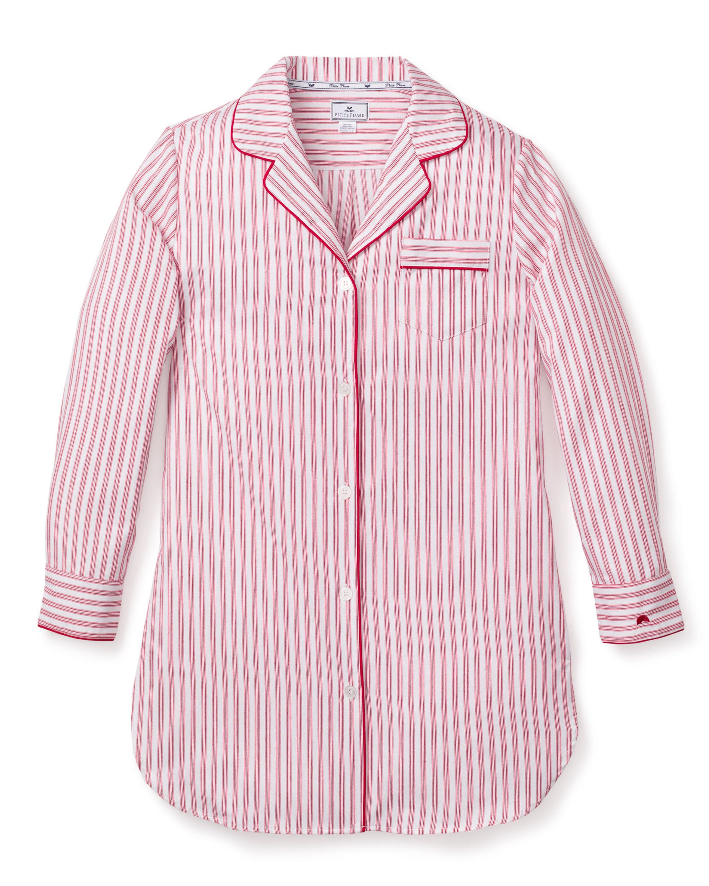 The Womens Twill Nightshirt in Antique Red Ticking by Petite Plume exudes luxury with pink and white stripes, crafted from premium cotton. Featuring a left chest pocket, collar, button closures, and elegantly pink-piped cuffs, this long-sleeved top blends comfort with sophistication.