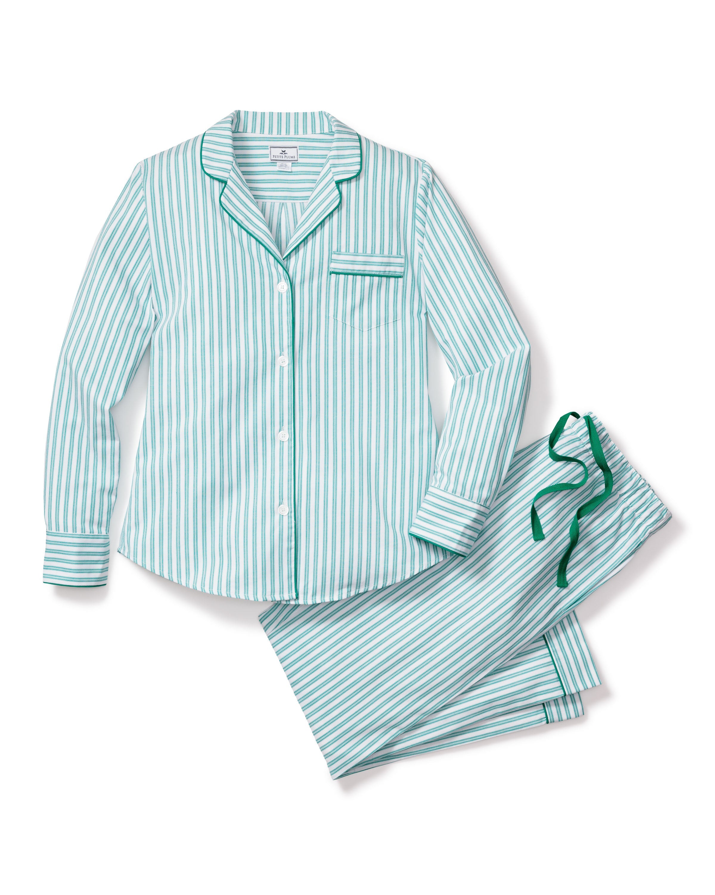 The Womens Twill Pajama Set in Emerald Ticking by Petite Plume is a two-piece cotton twill set with a button-up long-sleeve top featuring a pocket and collar, and matching pants with a drawstring waist. It boasts a classic French ticking pattern with vertical green and white stripes.
