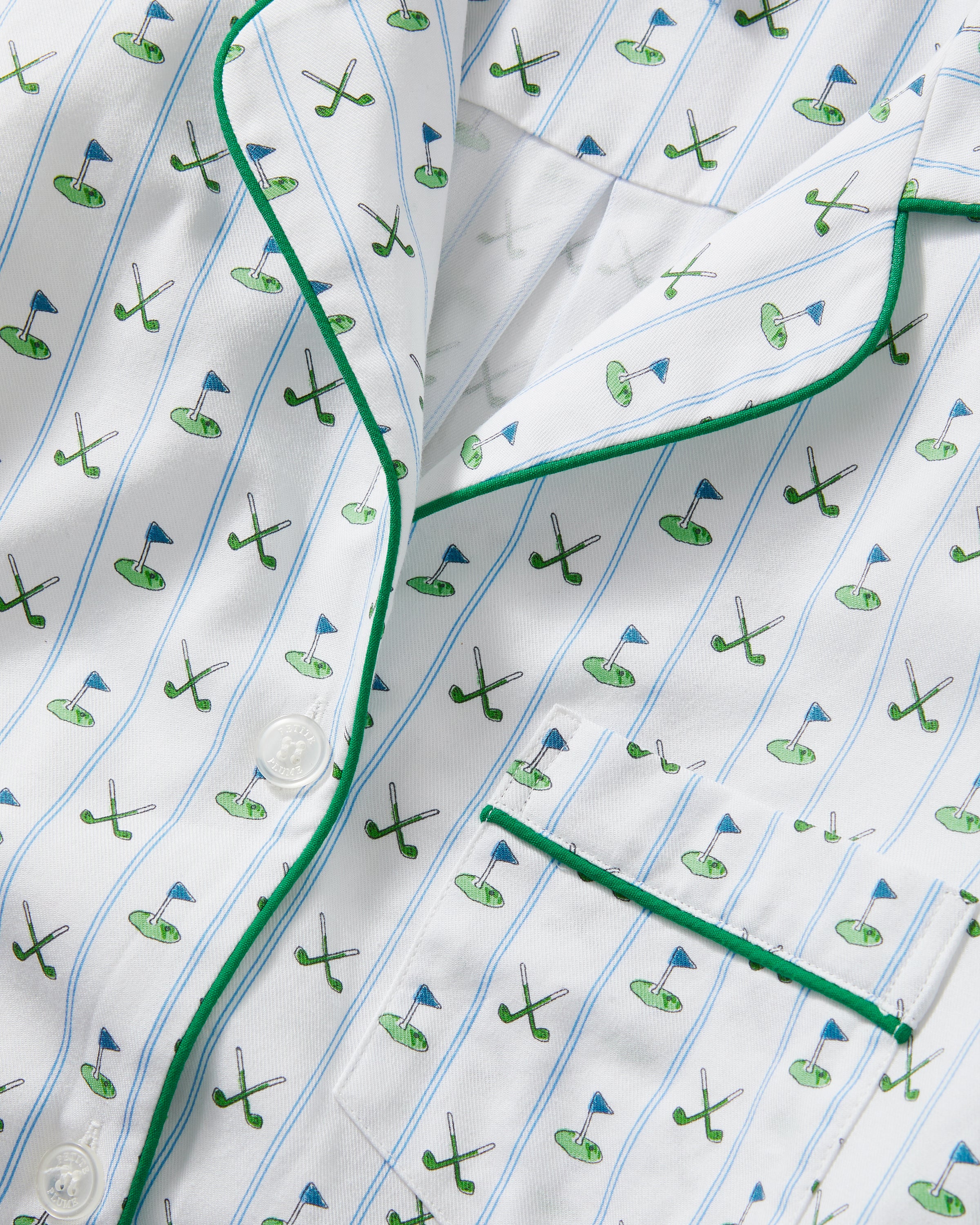 The Women's Twill Pajama Set in Fairway Stripe features a neatly folded white set with green stripes, including a long-sleeve button-up top with a chest pocket and matching drawstring pants.