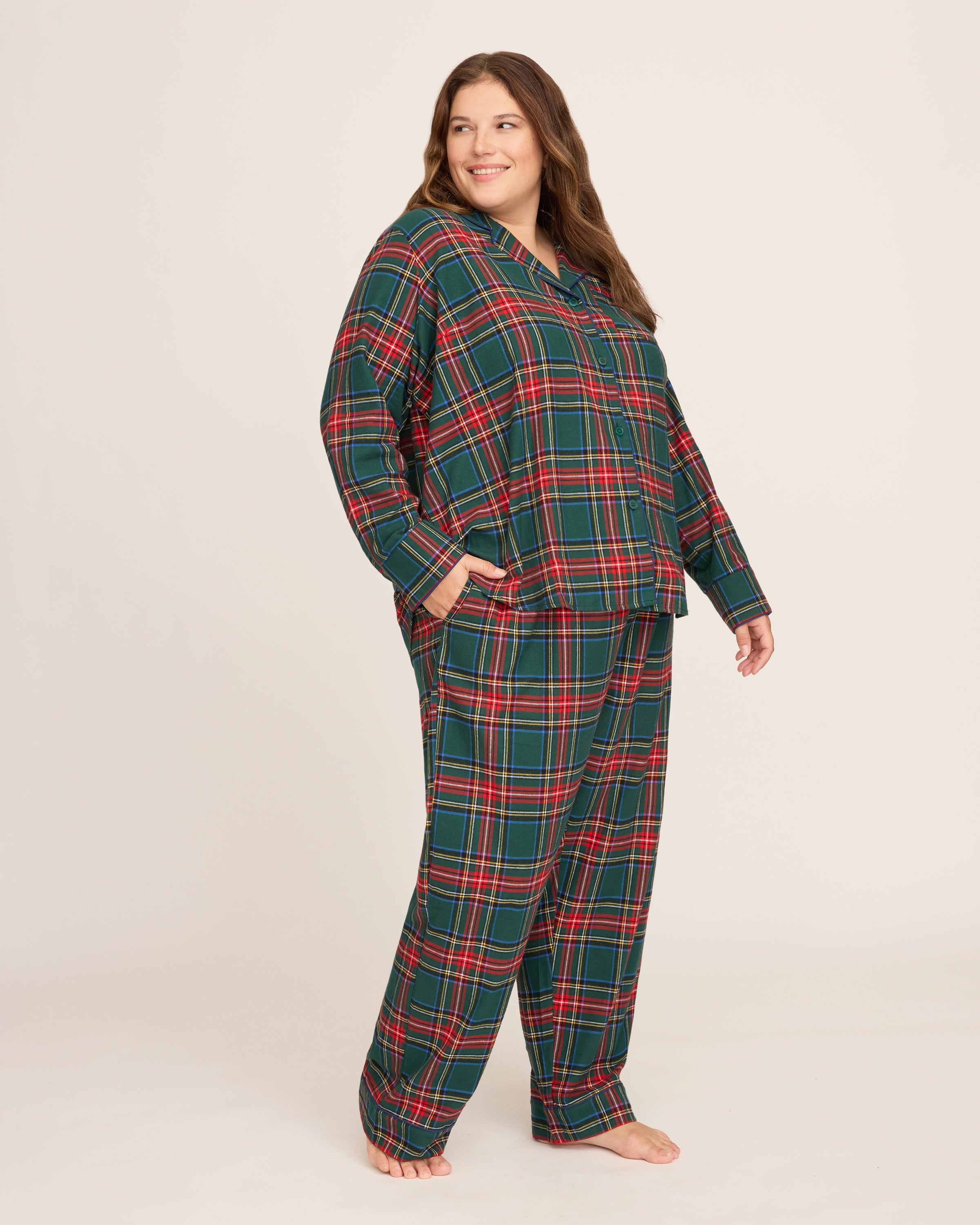 The Women's Brushed Twill Pajama Set in Kensington Tartan features a cozy green, red, and white plaid with a long-sleeve button-up top with chest pocket and matching elastic-waist pants.