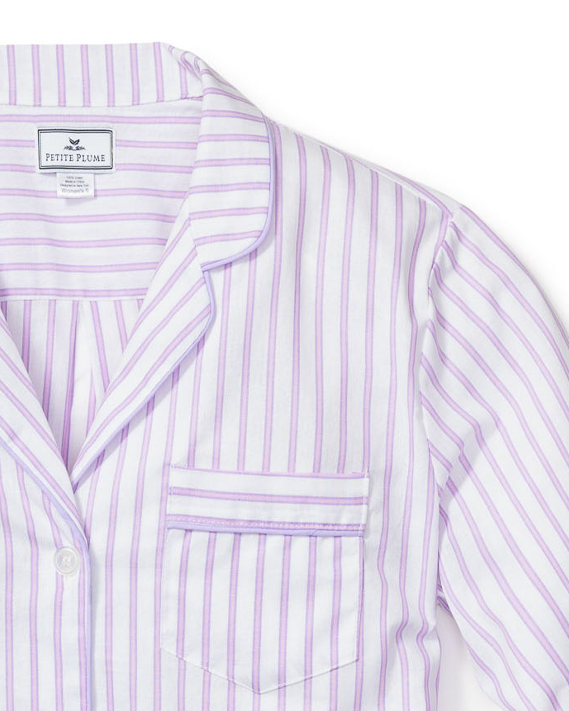 The Womens Twill Pajama Set from Petite Plume boasts a purple and white striped shirt, complete with a collar, chest pocket, and button-down front. Made from high-quality cotton, it’s ideal for fans of Lavender French Ticking.