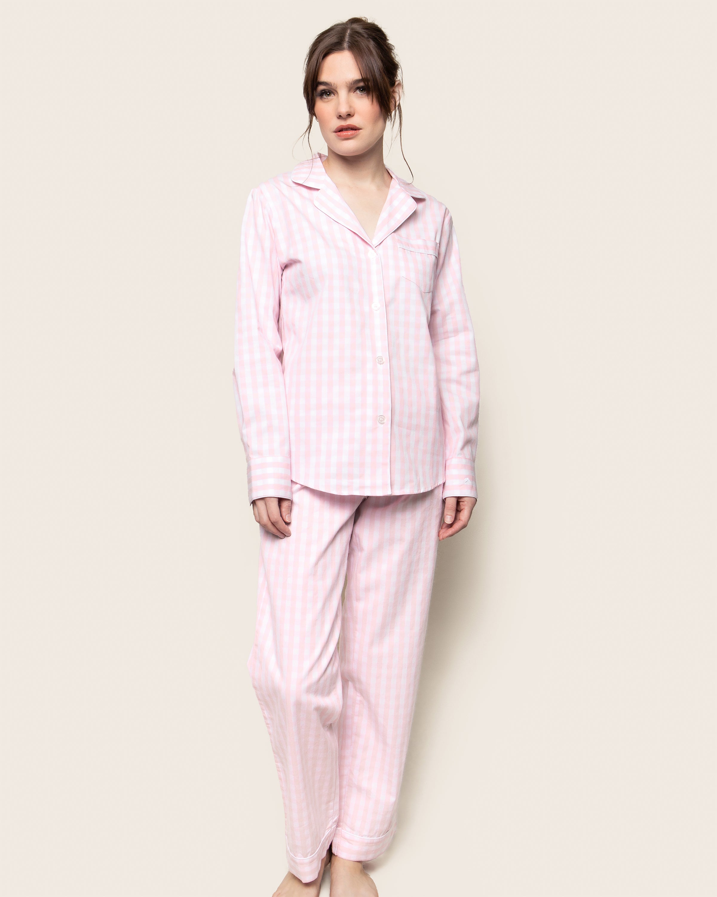 Women's Twill Pajama Set in Pink Gingham features a long-sleeve button-up top with a chest pocket and matching drawstring pants, shown laid flat on a white background.