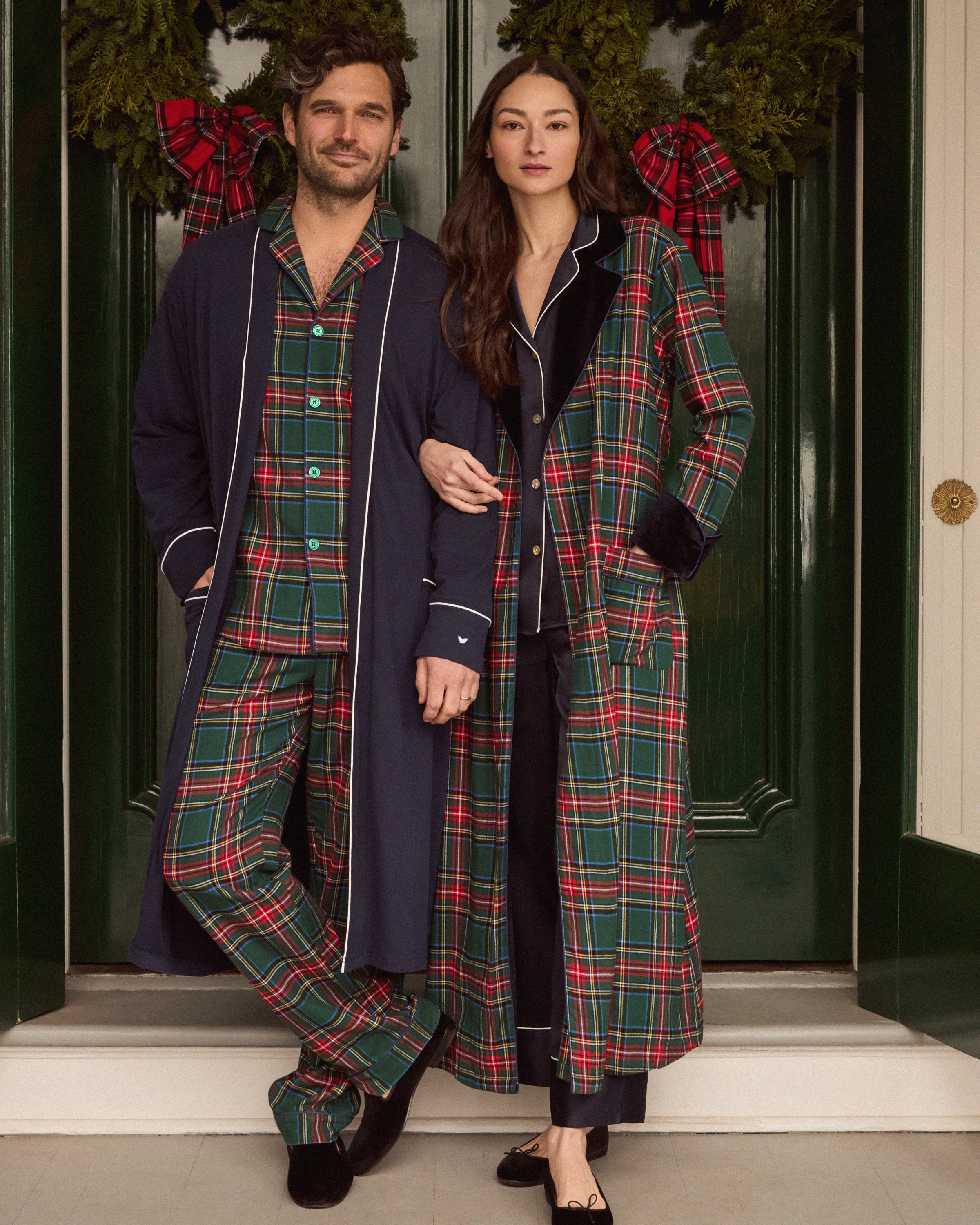 The Women's Brushed Twill Velvet Trim Robe in Kensington Tartan features green tartan with red and white stripes, a black velvet shawl collar and cuffs, a tie waist belt, and two large front pockets.