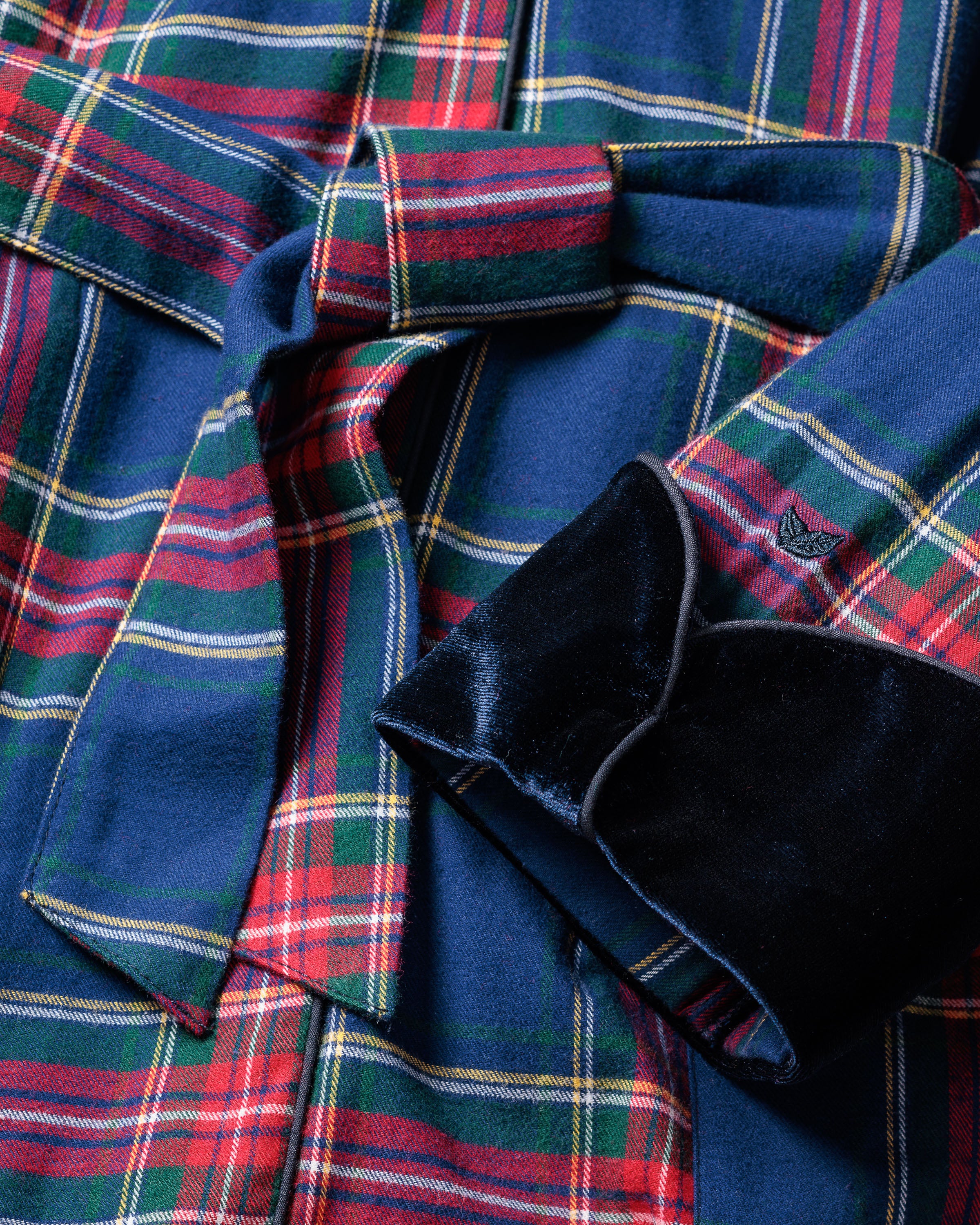 The Womens Car Coat with Velvet Trim in Windsor Tartan by Petite Plume features a blue, red, and green plaid pattern. This lightweight flannel includes a belt, velvet collar, and sleeve trim for a stylish and cozy appearance.