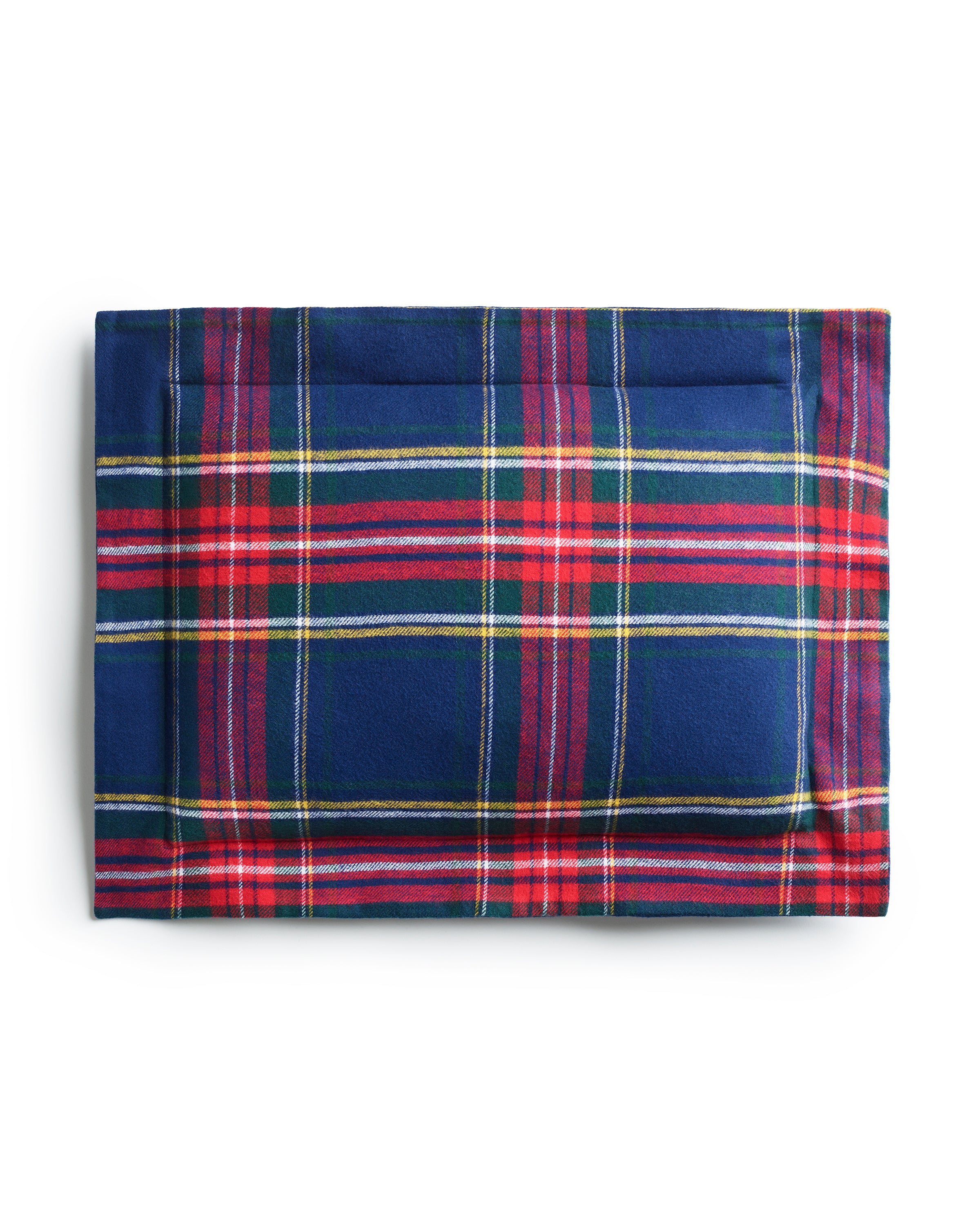 A folded Flannel Decorative Pillow in Windsor Tartan by Petite Plume, featuring a blue base with red, green, and white plaid pattern, crafted from brushed cotton flannel. It is neatly displayed against a plain white background.