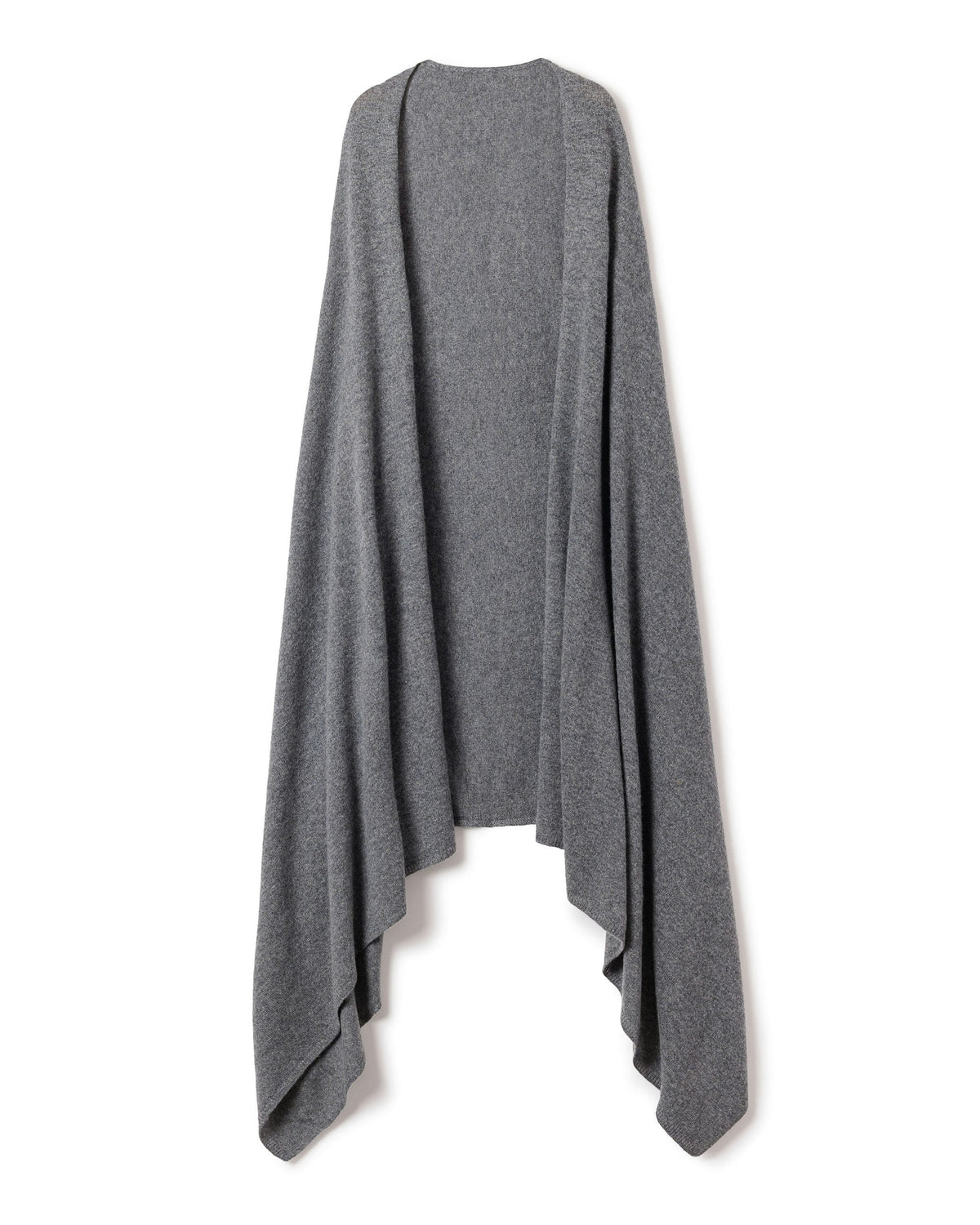 A woman with long dark hair is wrapped in Petite Plumes Womens Cashmere Wrap in Dark Grey, exuding warmth and elegance. She confidently poses in a white outfit against an off-white background.