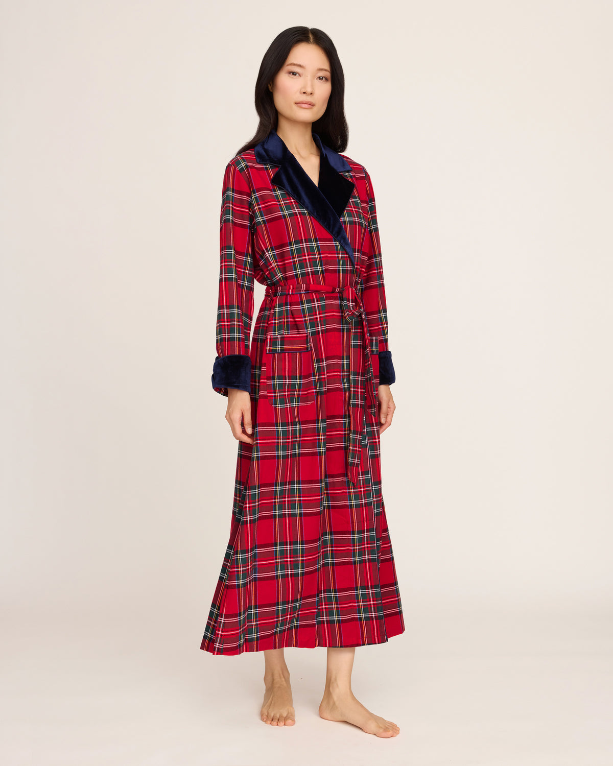 The Women's Long Robe with Velvet Trim in Imperial Tartan features a red plaid pattern, navy blue velvet collar and cuffs, matching belt, and two front pockets, displayed flat on a white background.