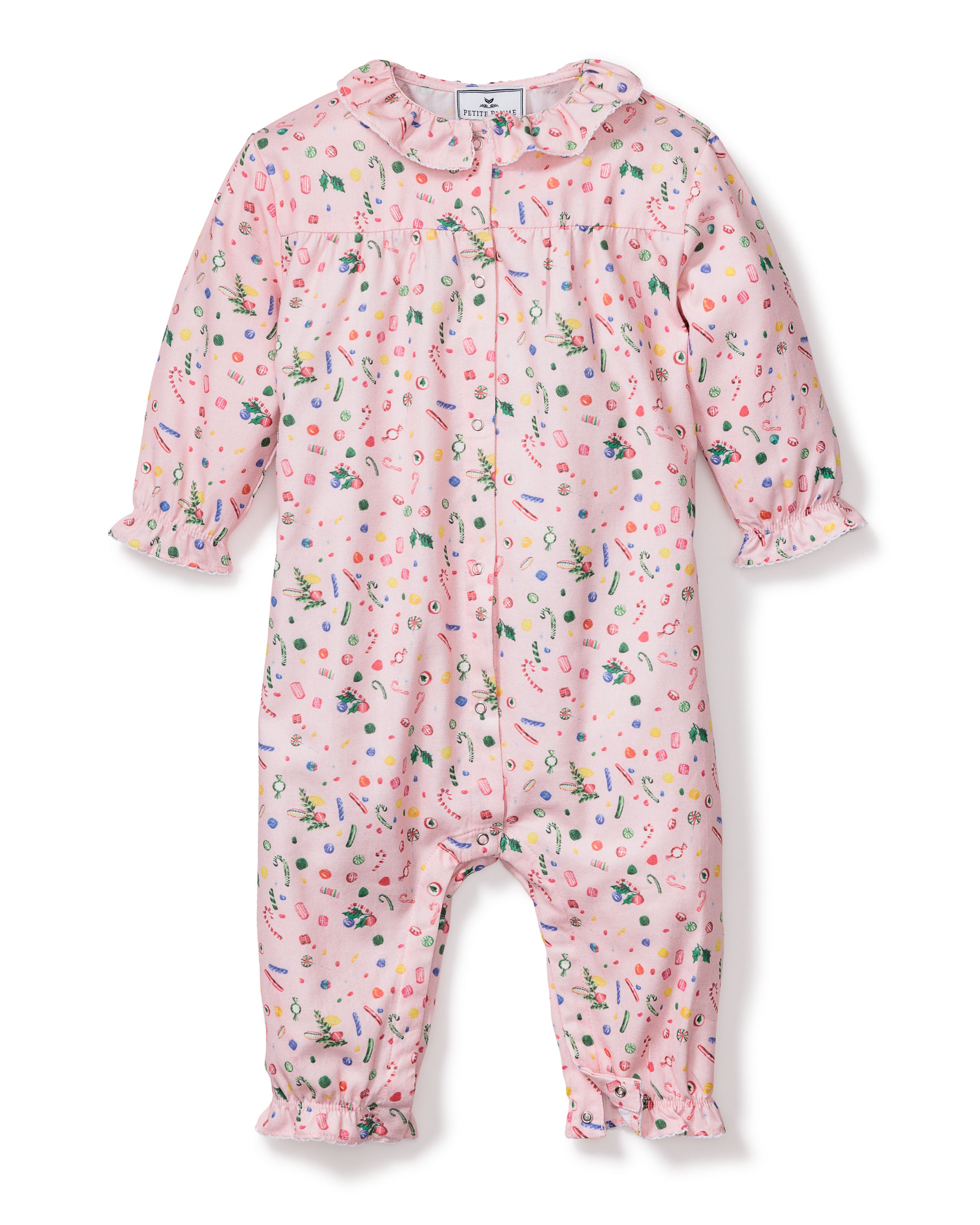 The Babys Twill Madeline Romper in Vintage Sweets by Petite Plume features a colorful pattern, long sleeves, elastic cuffs, and a rounded neckline with front buttons. Made from flame-retardant fabric, its ideal for cozy sleepwear nights.