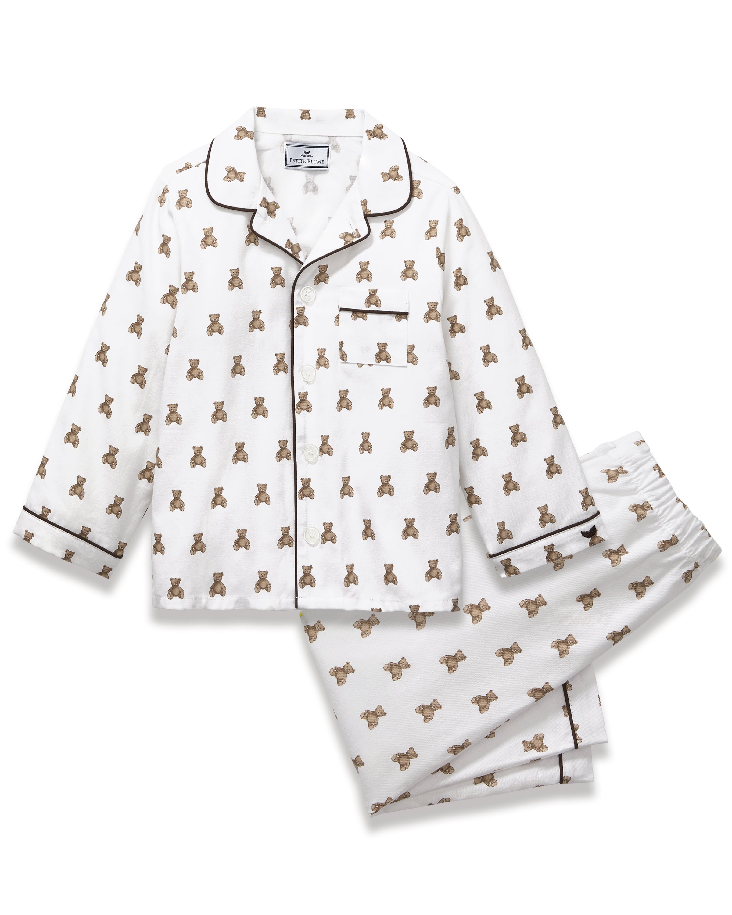Kid's Twill Pajama Set in Teddy Tales: white long-sleeve, button-up pajamas with pants, featuring brown teddy bear print, dark piping along edges and chest pocket.