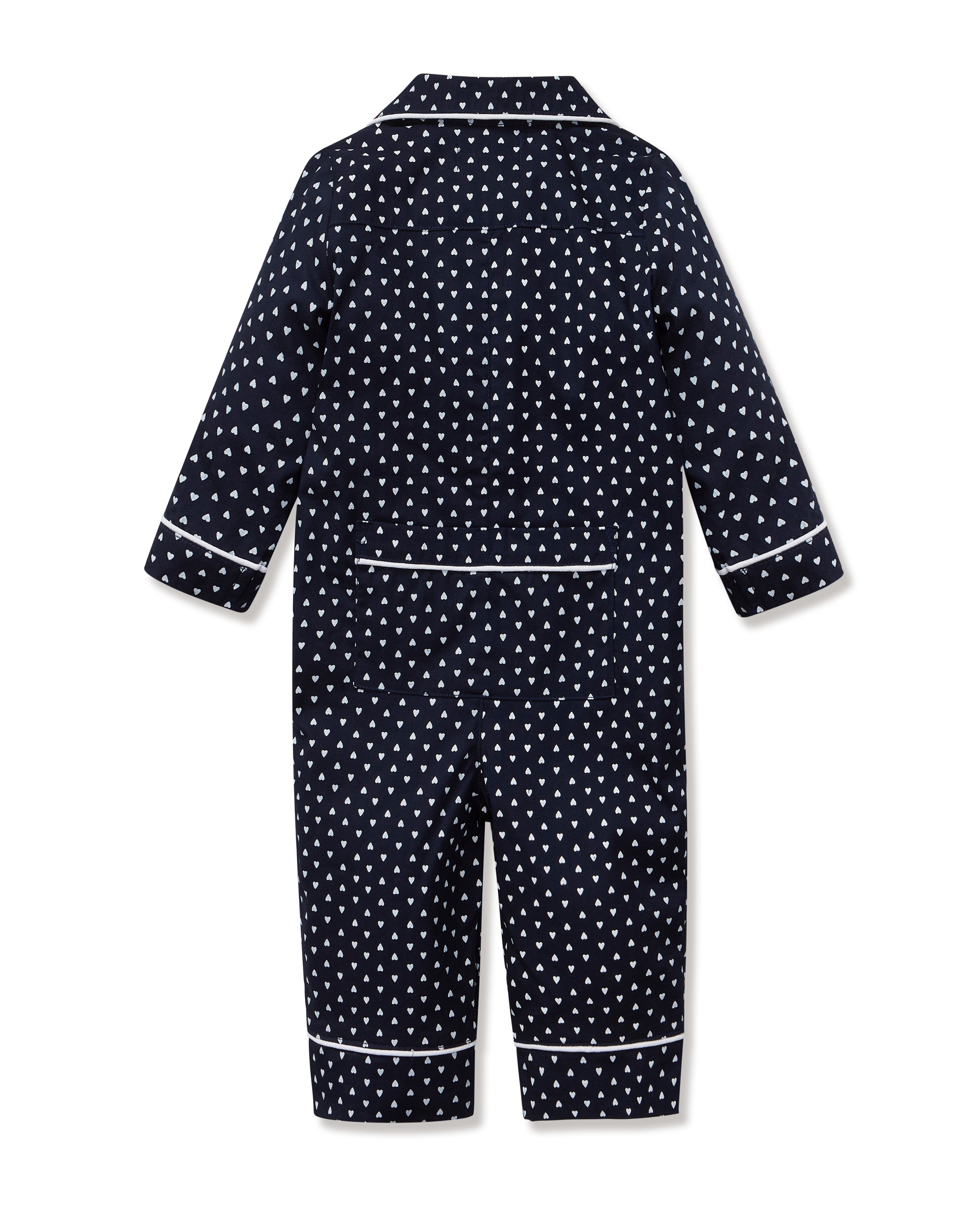 The Baby's Twill Classic Romper in Midnight Hearts is a navy blue onesie with long sleeves and legs, featuring a white heart pattern and white piping on the collar, cuffs, and front.