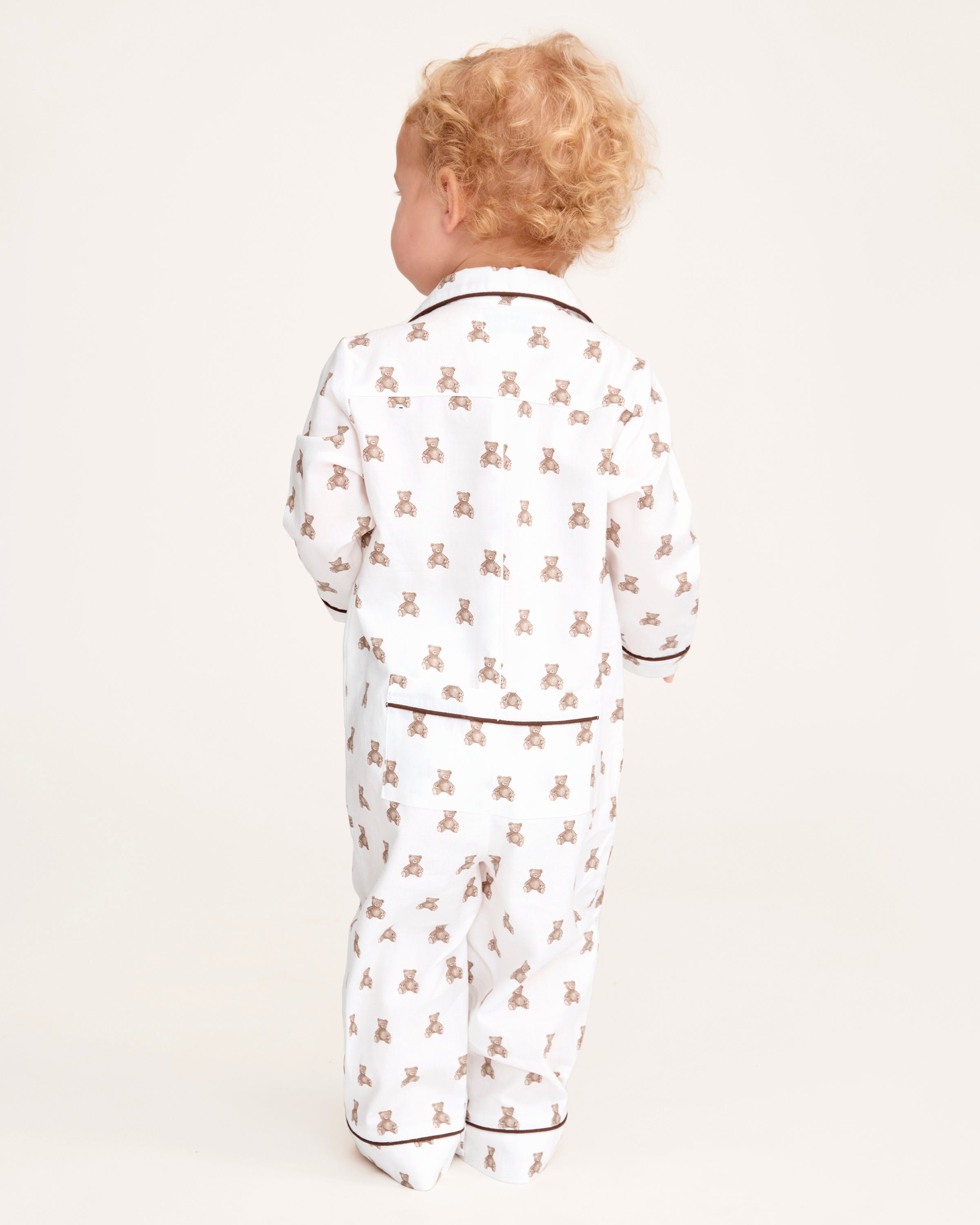 A white and brown Baby's Twill Classic Romper in Teddy Tales.