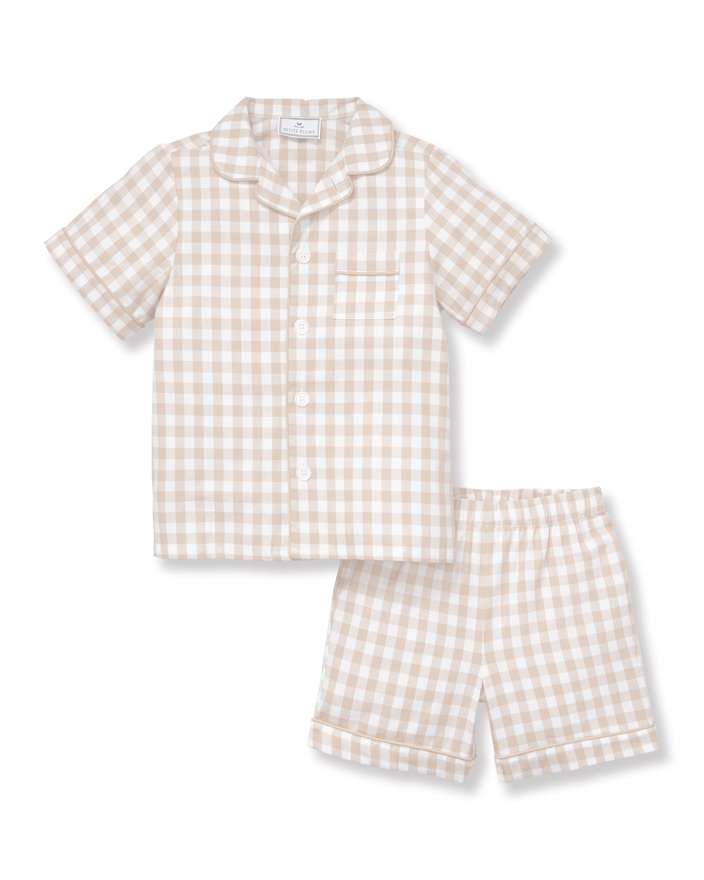 The Kid's Twill Pajama Short Set in Camel Gingham features a light beige and white gingham pattern with a collared, button-front top, chest pocket, and elastic waist shorts.