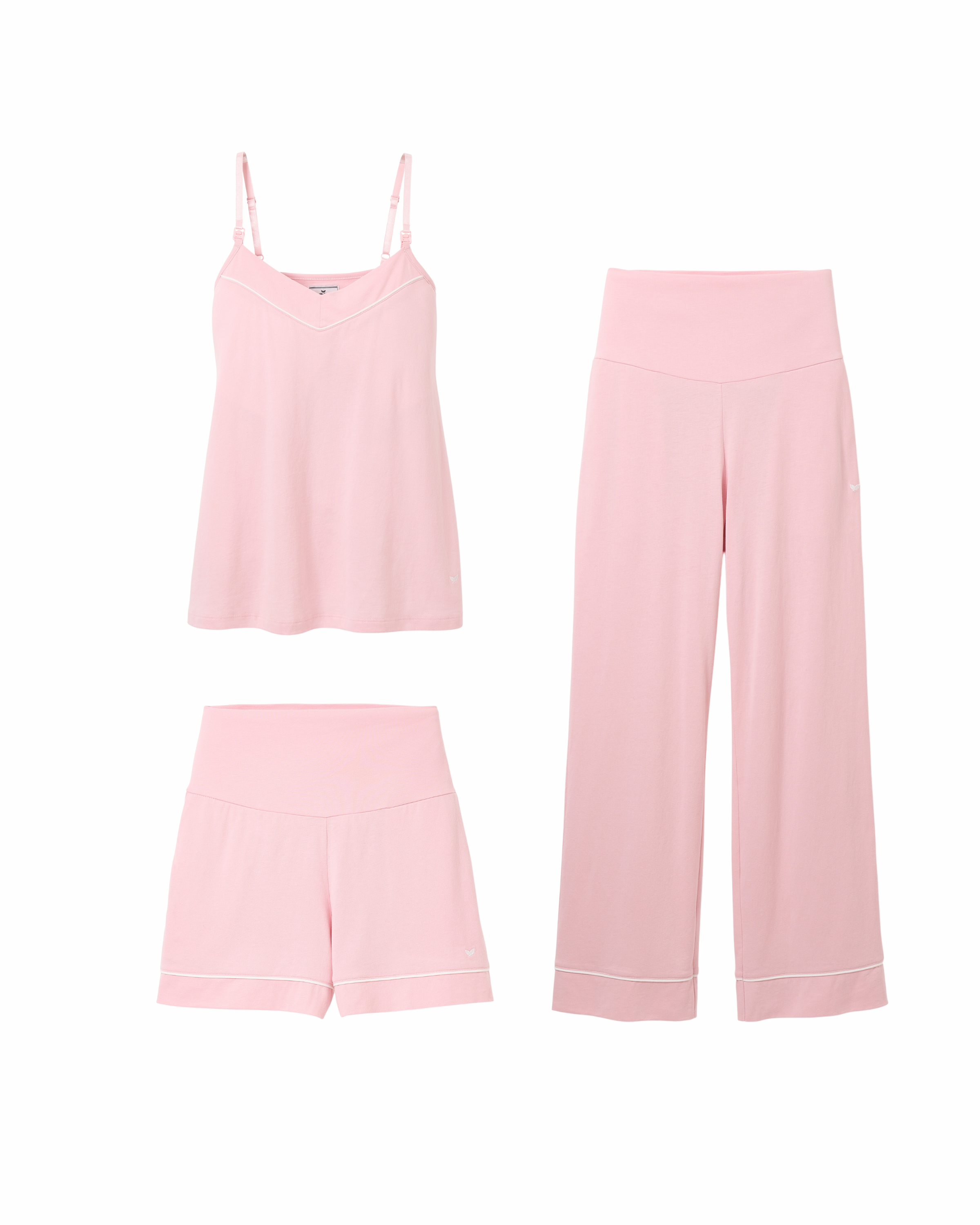 Three pieces from Petite Plumes The Basics Maternity Set in Pink are showcased against a white background: a pastel pink camisole with spaghetti straps, wide-leg pants, and shorts. Each Pima cotton item features subtle white trim details, offering both comfort and style.