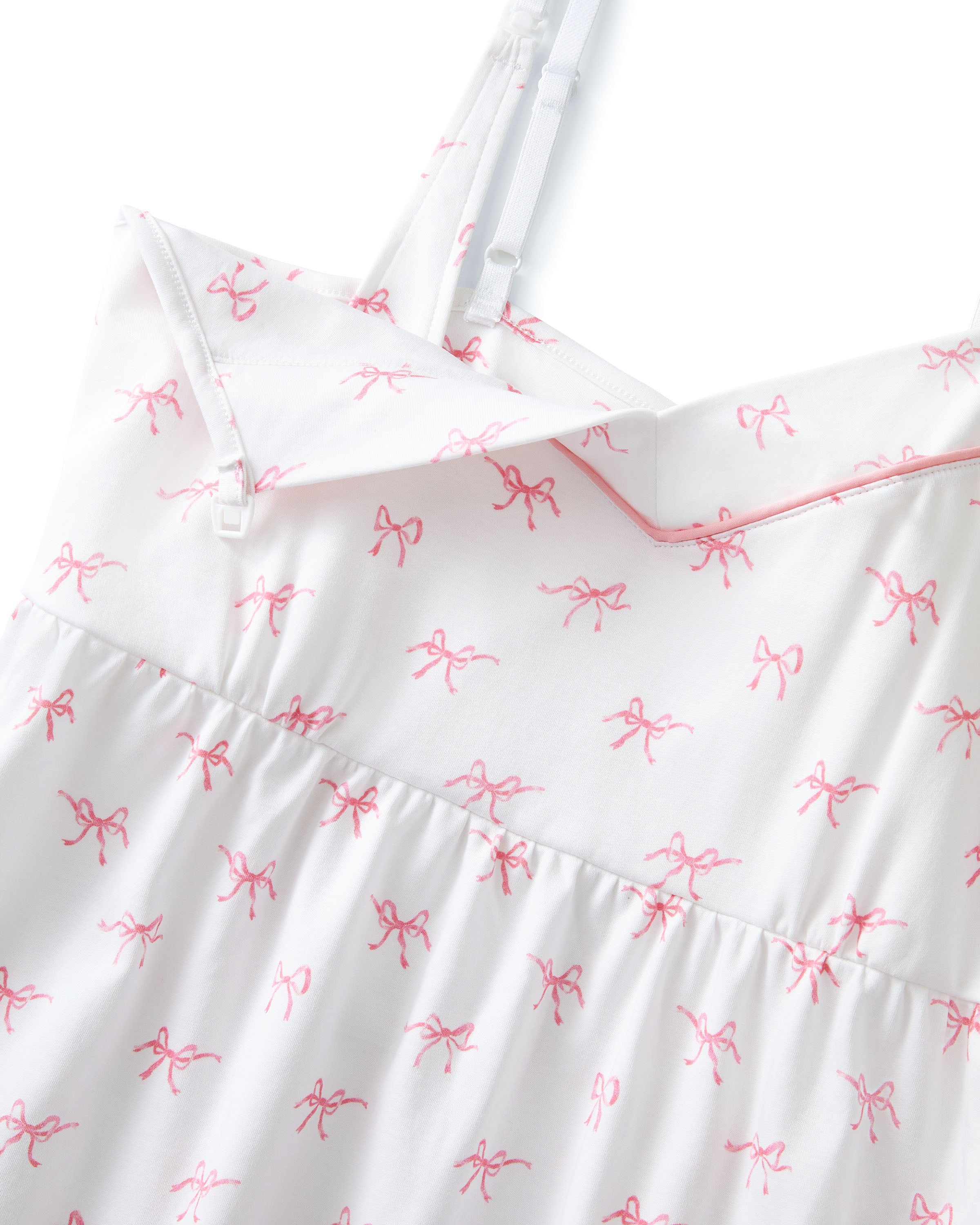 The Women's Pima Maternity Nightgown in Blushing Bows is a white sleeveless spaghetti strap dress with a fitted bust, slightly flared skirt, and an all-over print of small pink bows.