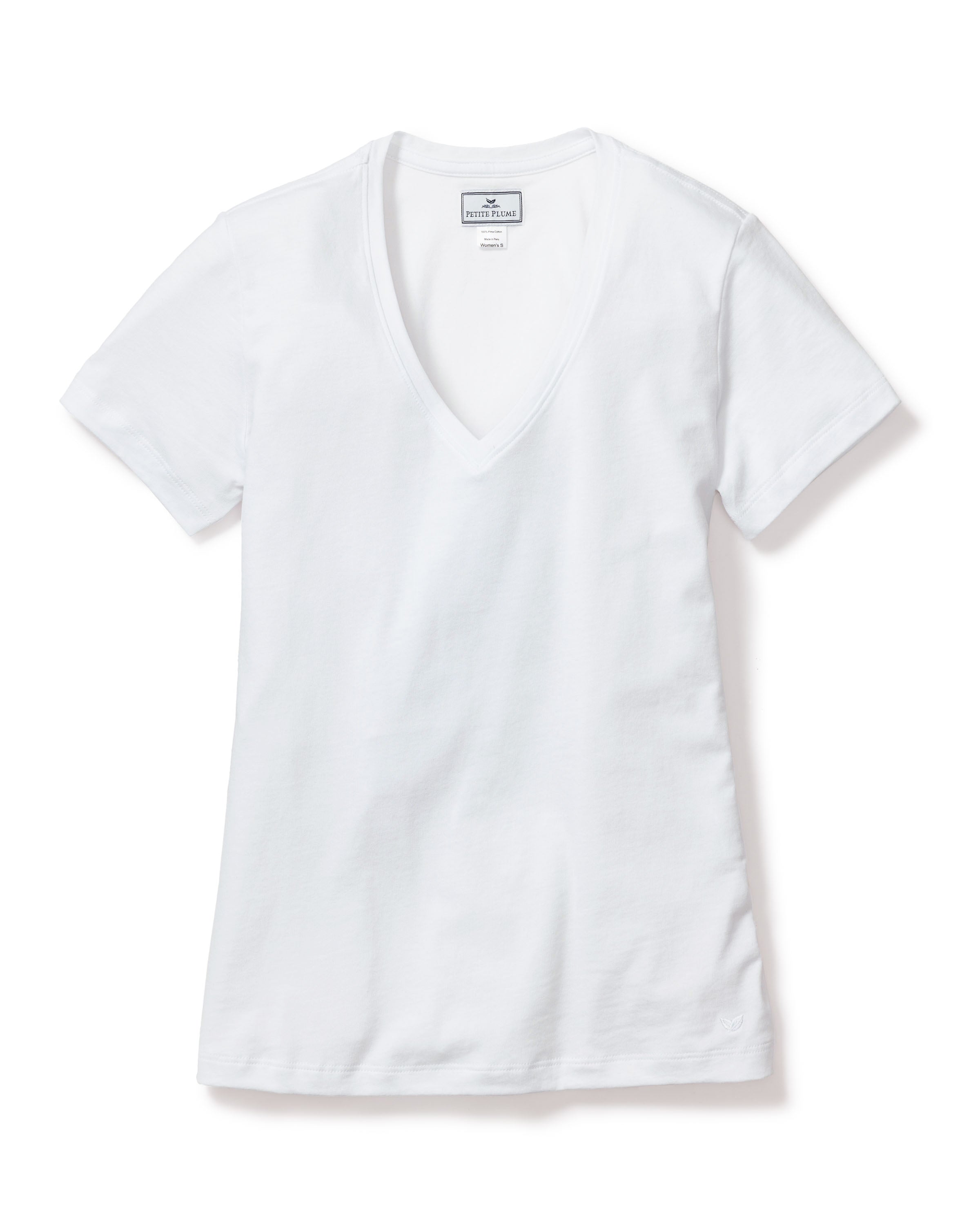 The Petite Plume Womens Pima Short Sleeve Top in White is a simple, clean V-neck T-shirt made from soft Peruvian Pima cotton, shown laid flat on a white background with a visible neckline tag.
