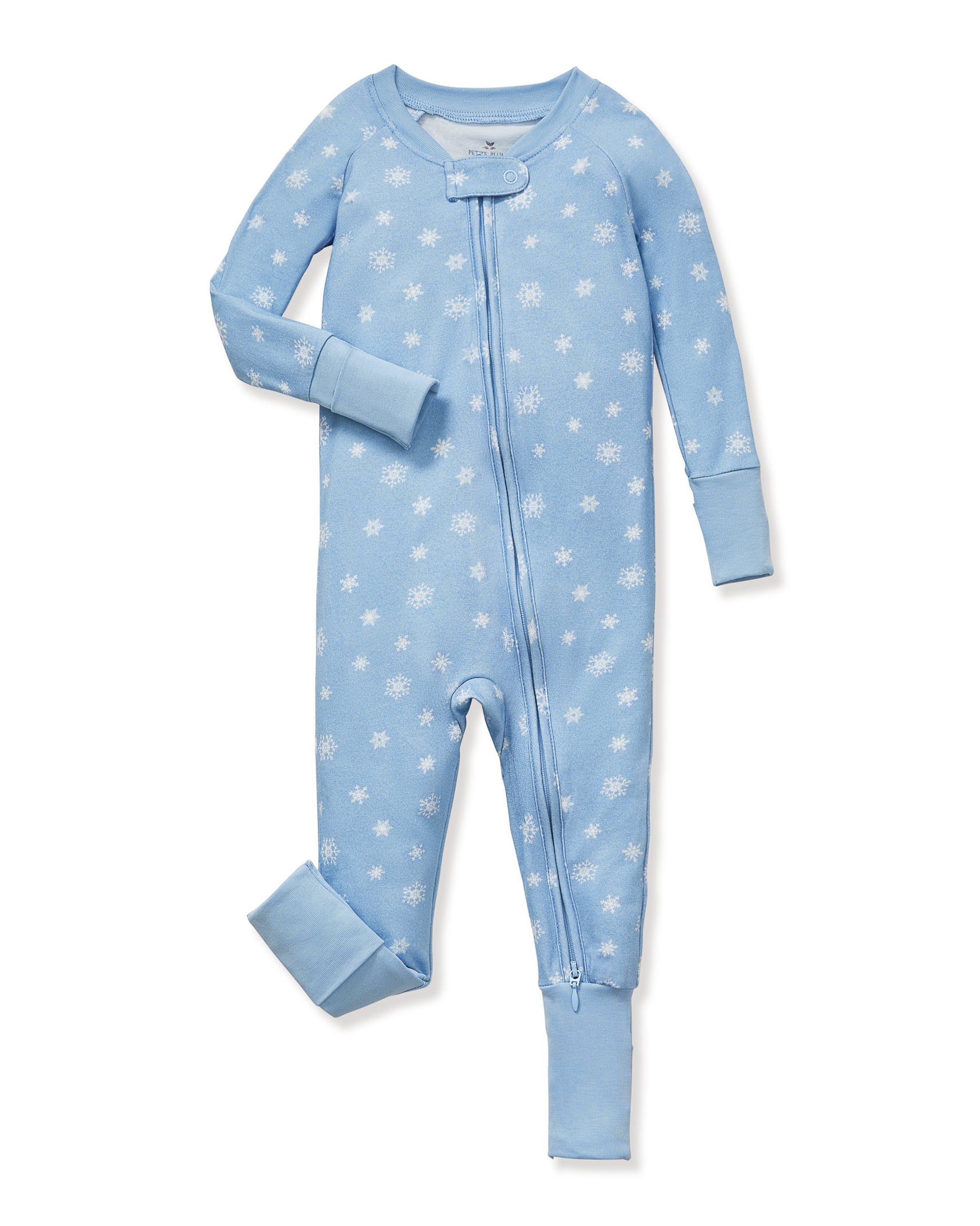 The Baby's Pima Peekaboo Romper in Periwinkle Wonderland features a light blue snowflake pattern, long sleeves with fold-over cuffs, and a diagonal zipper from neckline to left ankle; one sleeve and one leg are folded.
