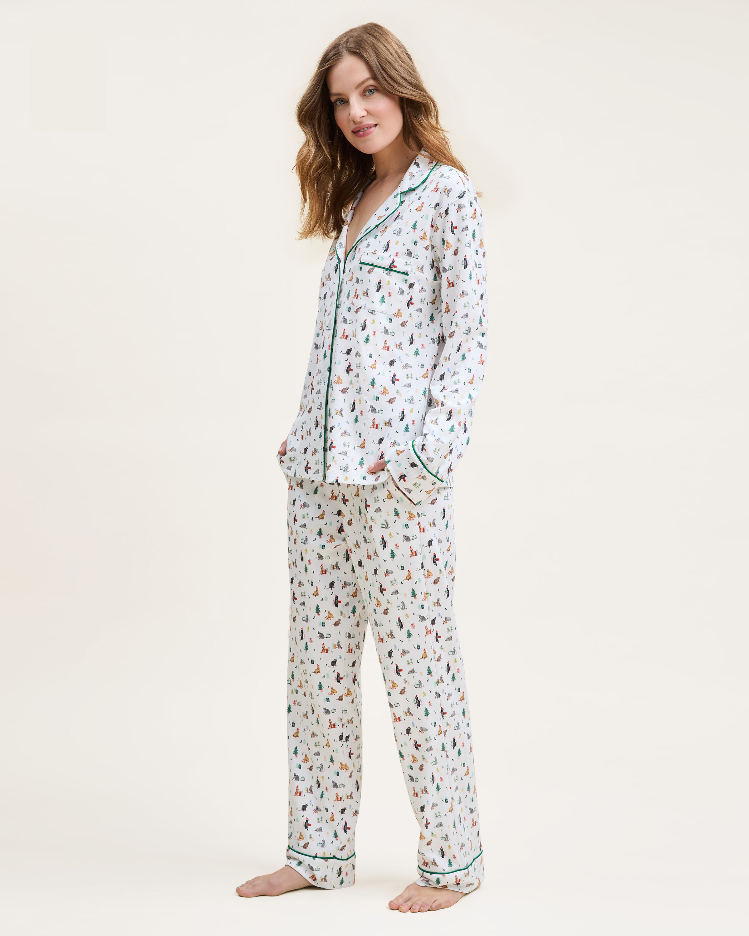 Woman wearing a patterned pajama set on a white background