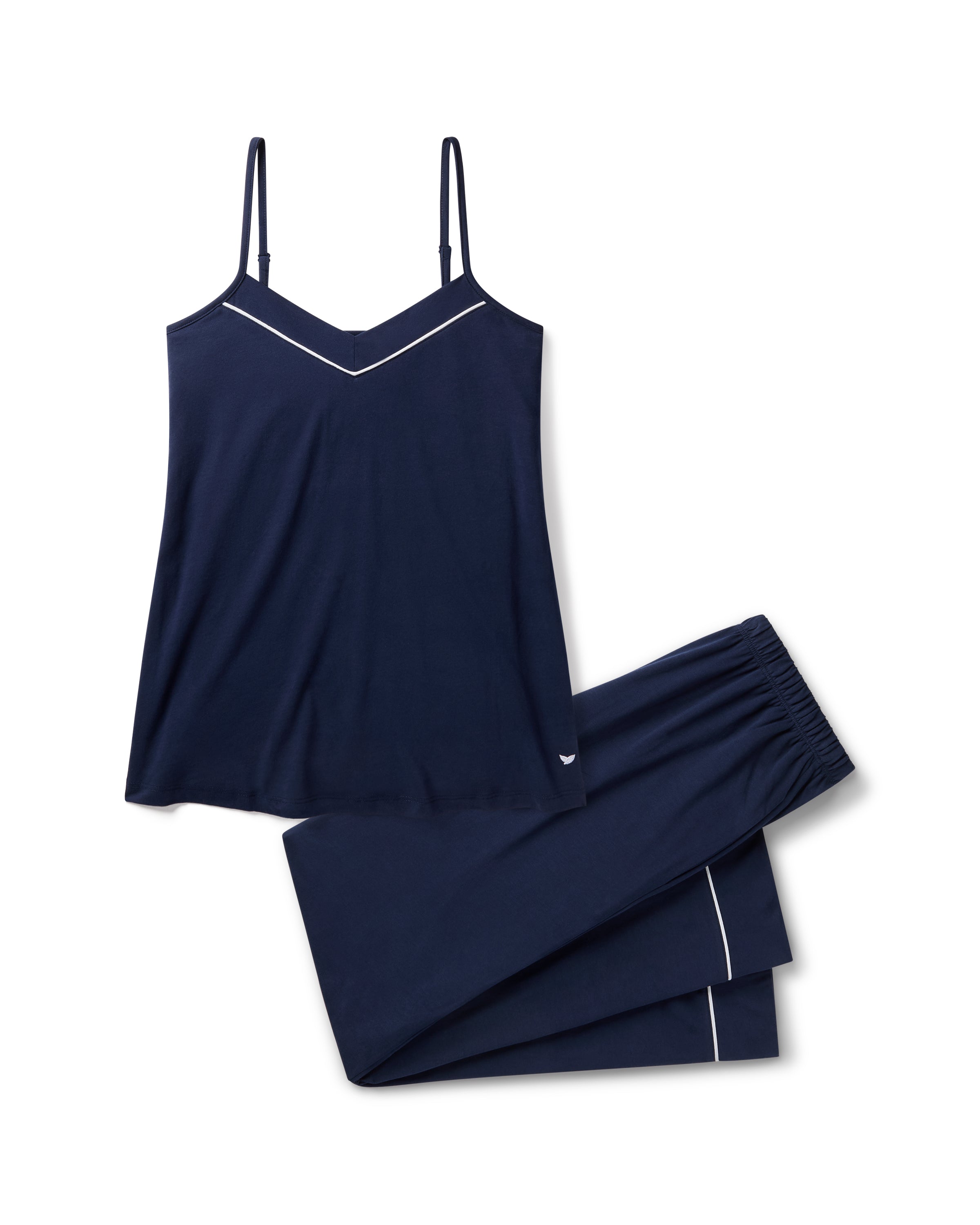 The Women's Pima Sylvie Pajama Set in Navy includes a sleeveless V-neck camisole with thin straps and matching long pants, both featuring white trim. The set is displayed flat on a white background.