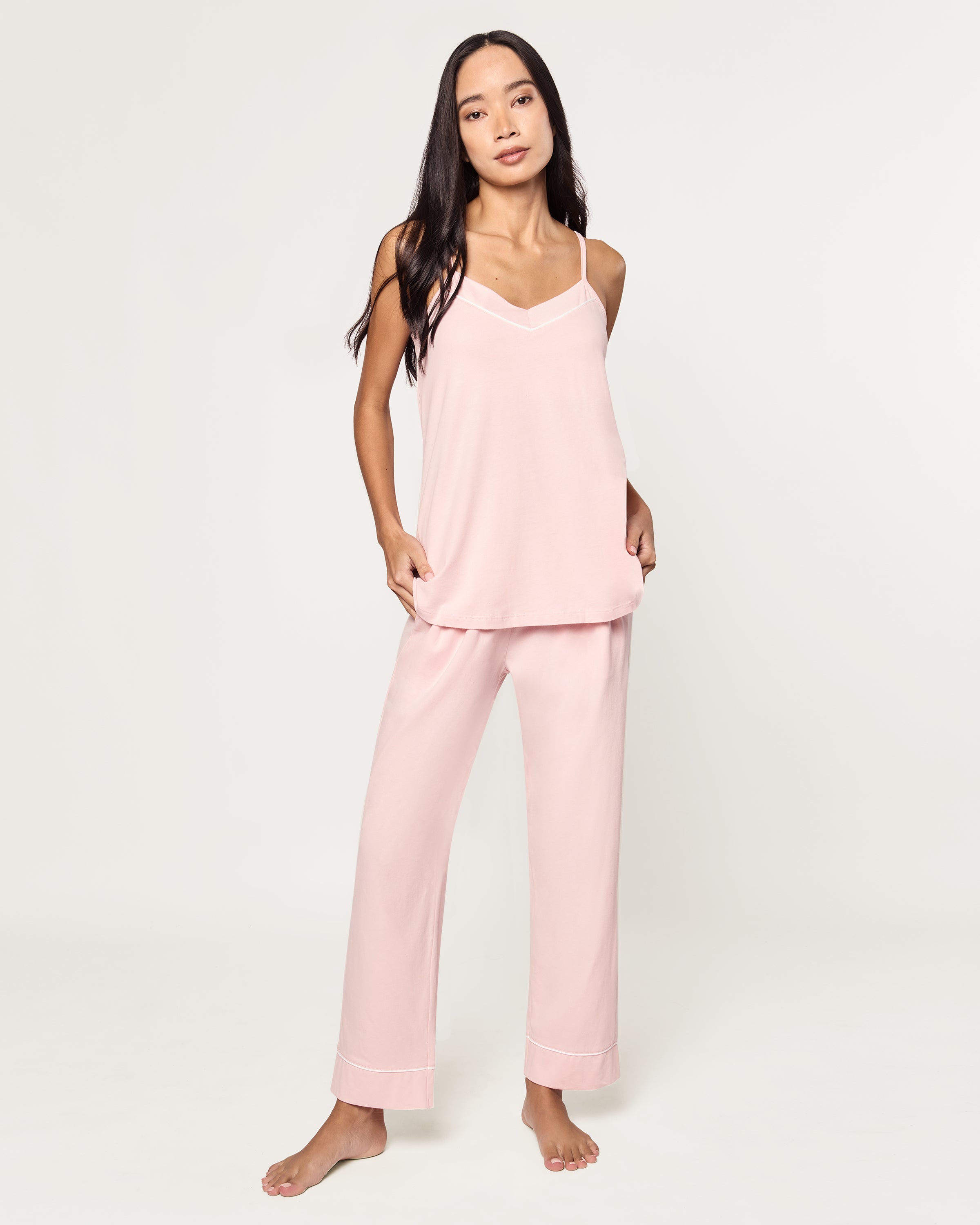 The Women's Pima Sylvie Pajama Set in Pink includes a sleeveless V-neck camisole with thin straps and matching elastic-waist pants, both accented with subtle white stitching.