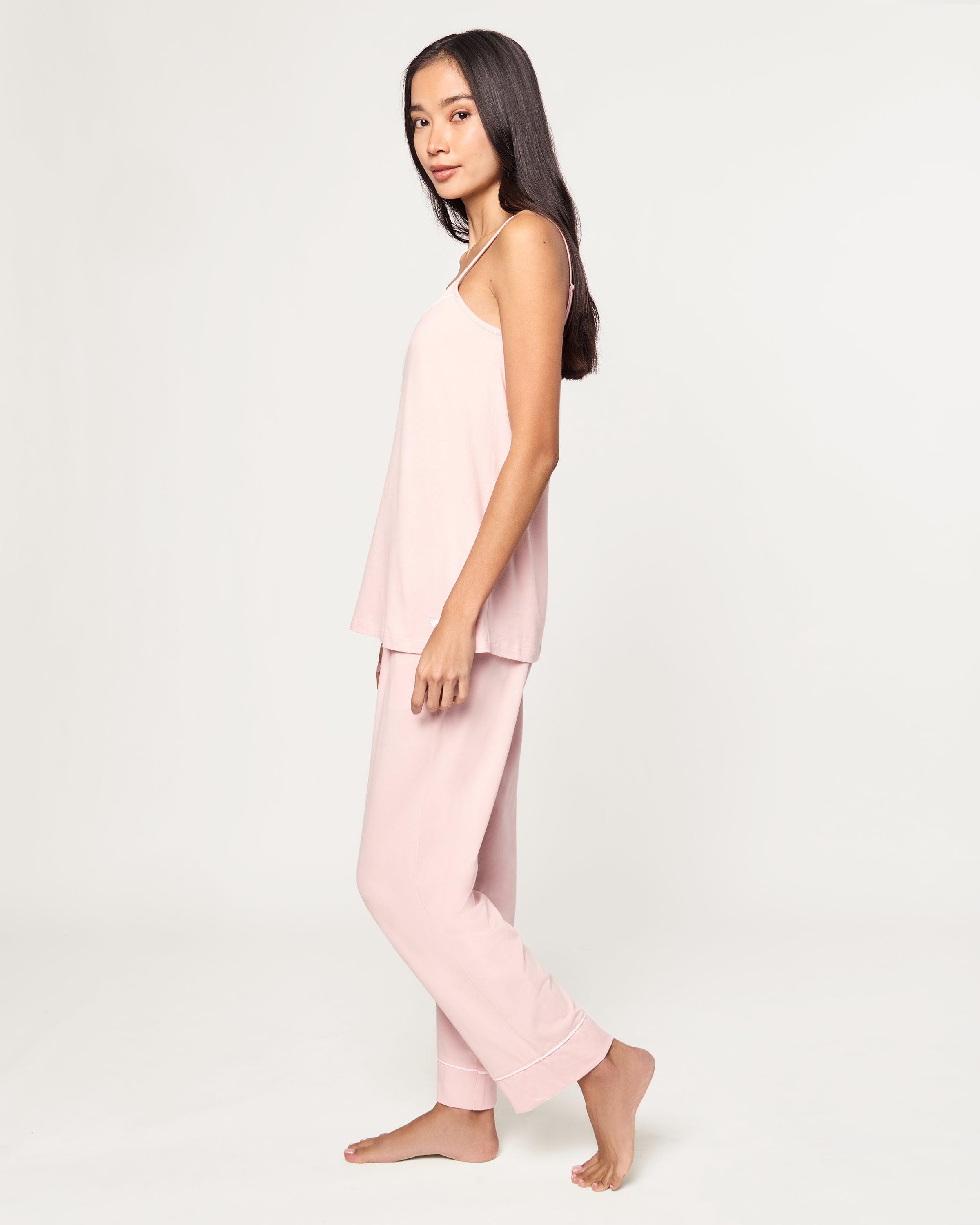 The Women's Pima Sylvie Pajama Set in Pink includes a sleeveless V-neck camisole with thin straps and matching elastic-waist pants, both accented with subtle white stitching.