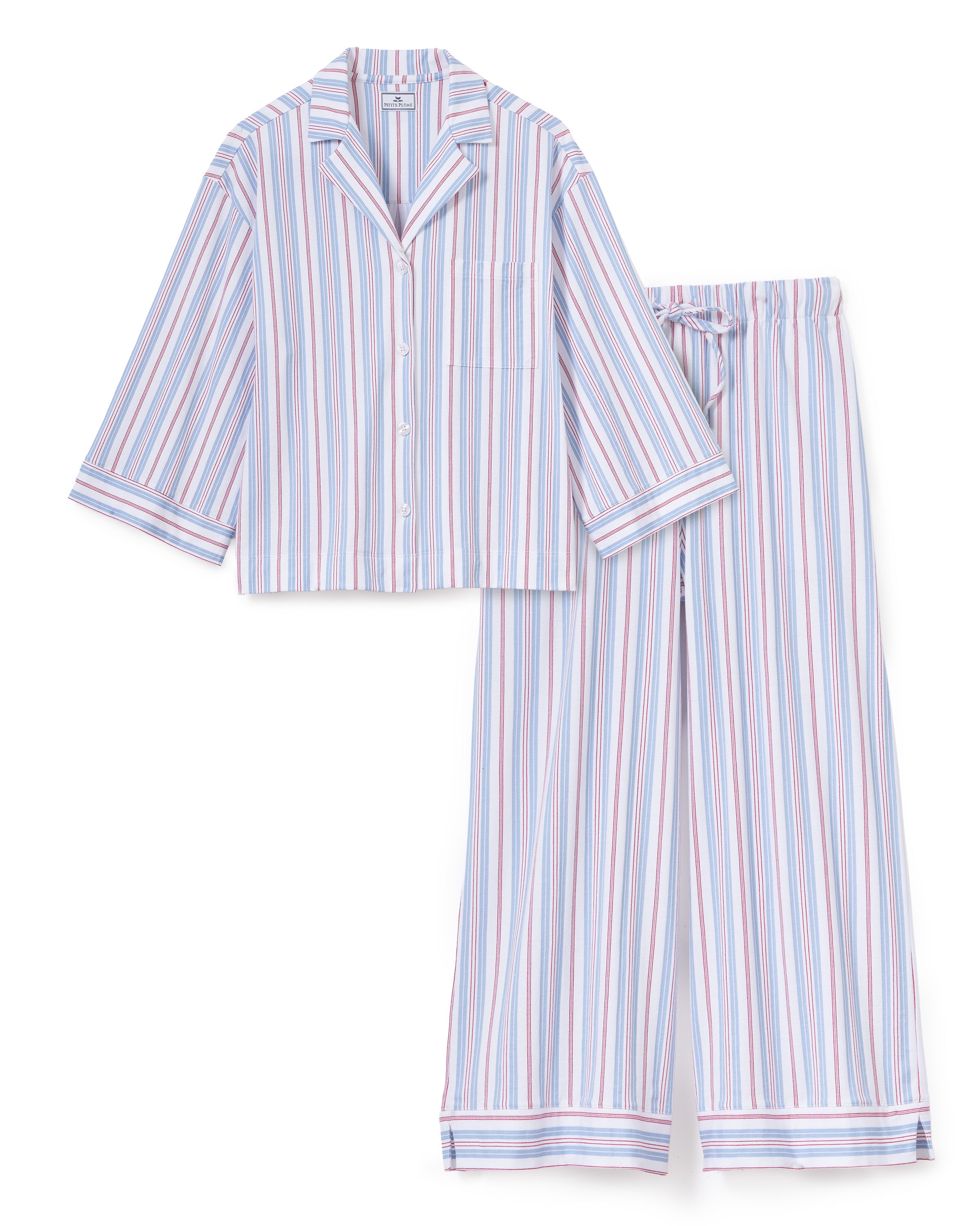 The Olivia Wide Leg Lightweight Pima Pajama Set in Vintage French Stripes features a coordinating button-up, long-sleeve top and relaxed wide-leg pants, both adorned with vertical stripes in blue, red, and white.