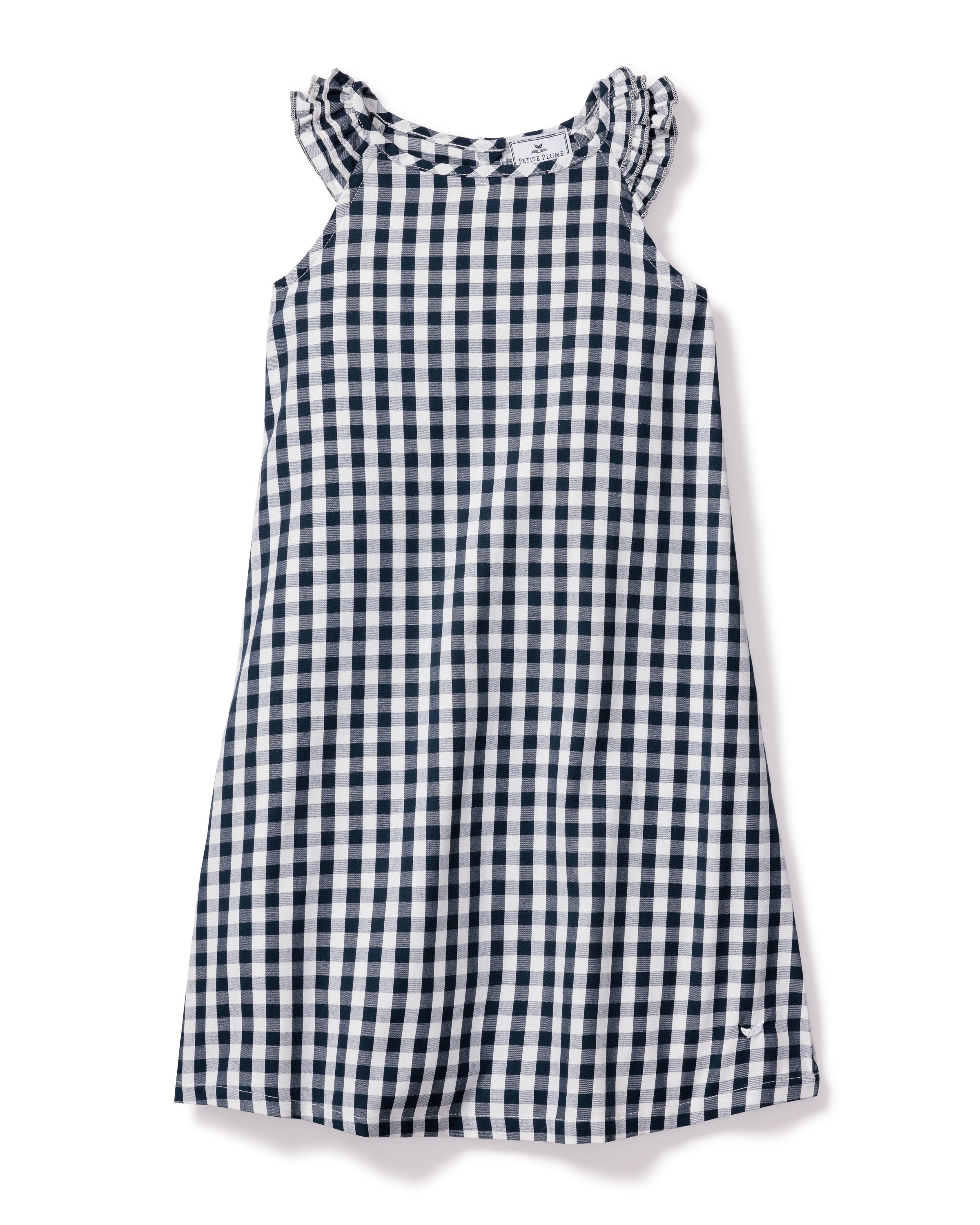The Girls Twill Amelie Nightgown in Navy Gingham by Petite Plume is a sleeveless cotton dress with a navy and white check pattern. It has a round neck with subtle ruffle detailing for added charm.