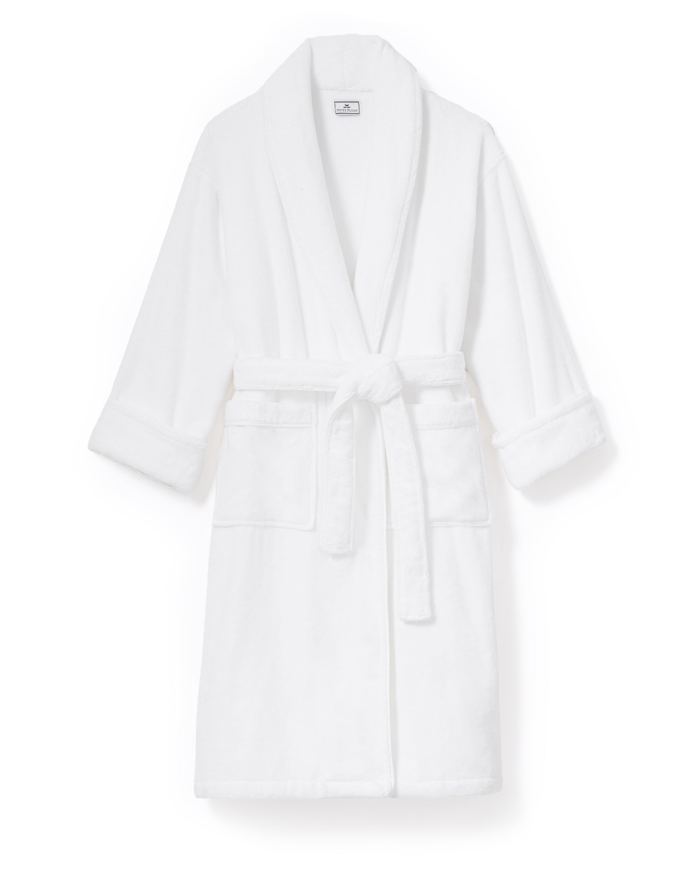 The Unisex Luxe Terry Robe in White features long sleeves, a shawl collar, two front pockets, and a waist tie belt, displayed against a white background.